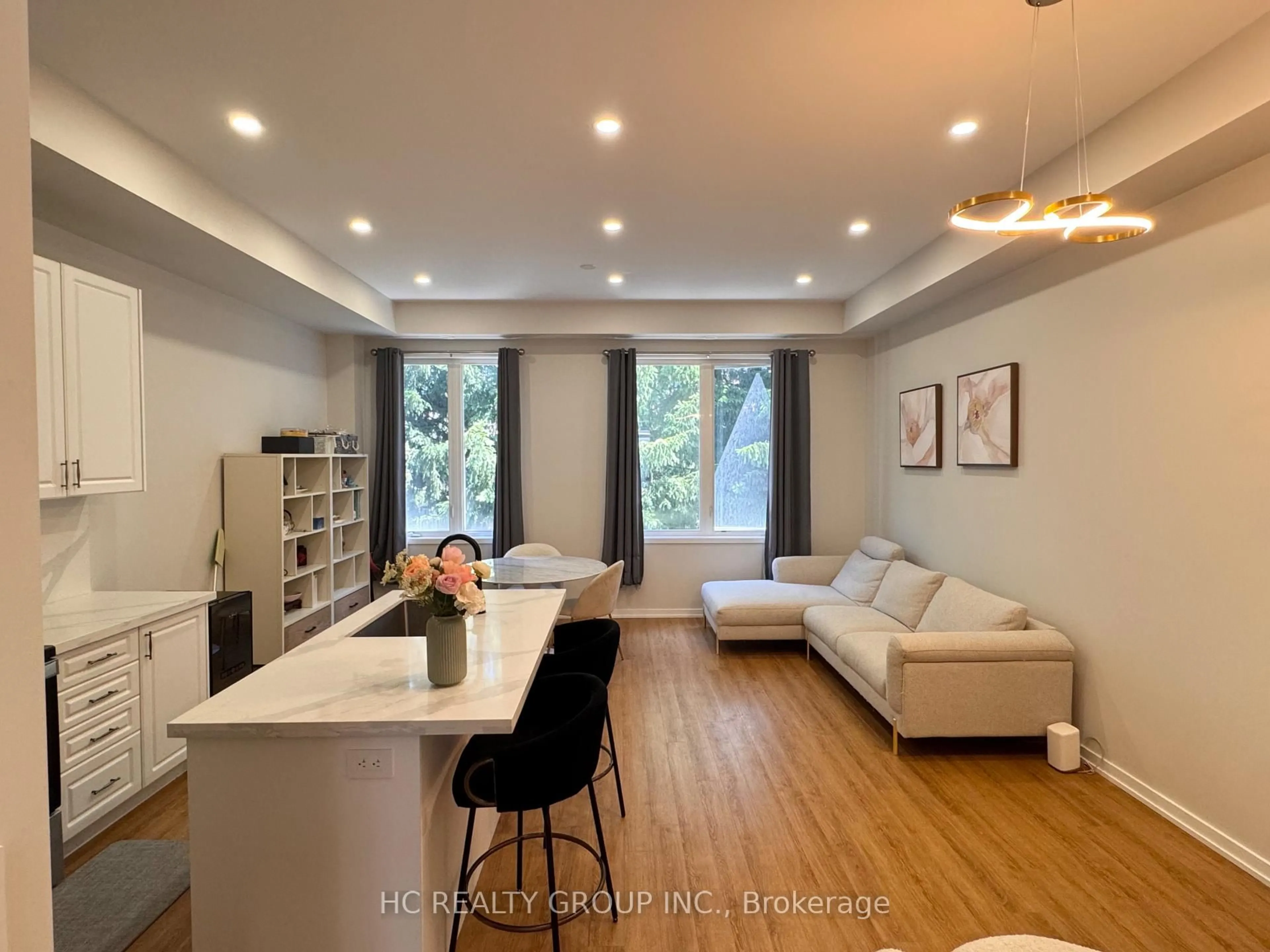 Living room with furniture, wood/laminate floor for 58 Pantheon Lane, Markham Ontario L6E 0V3