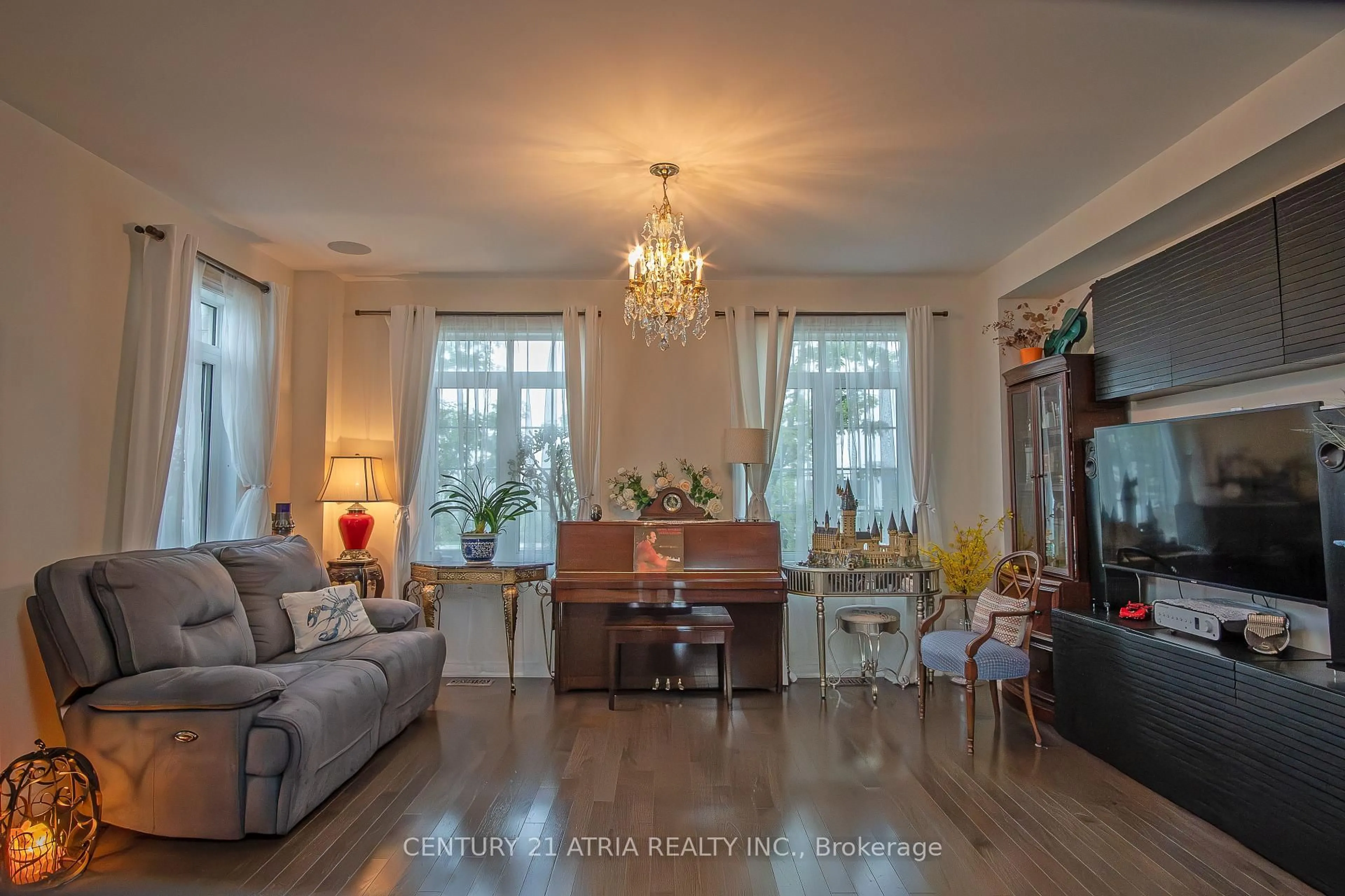 Living room with furniture, wood/laminate floor for 10951 Woodbine Ave, Markham Ontario L6C 0X4