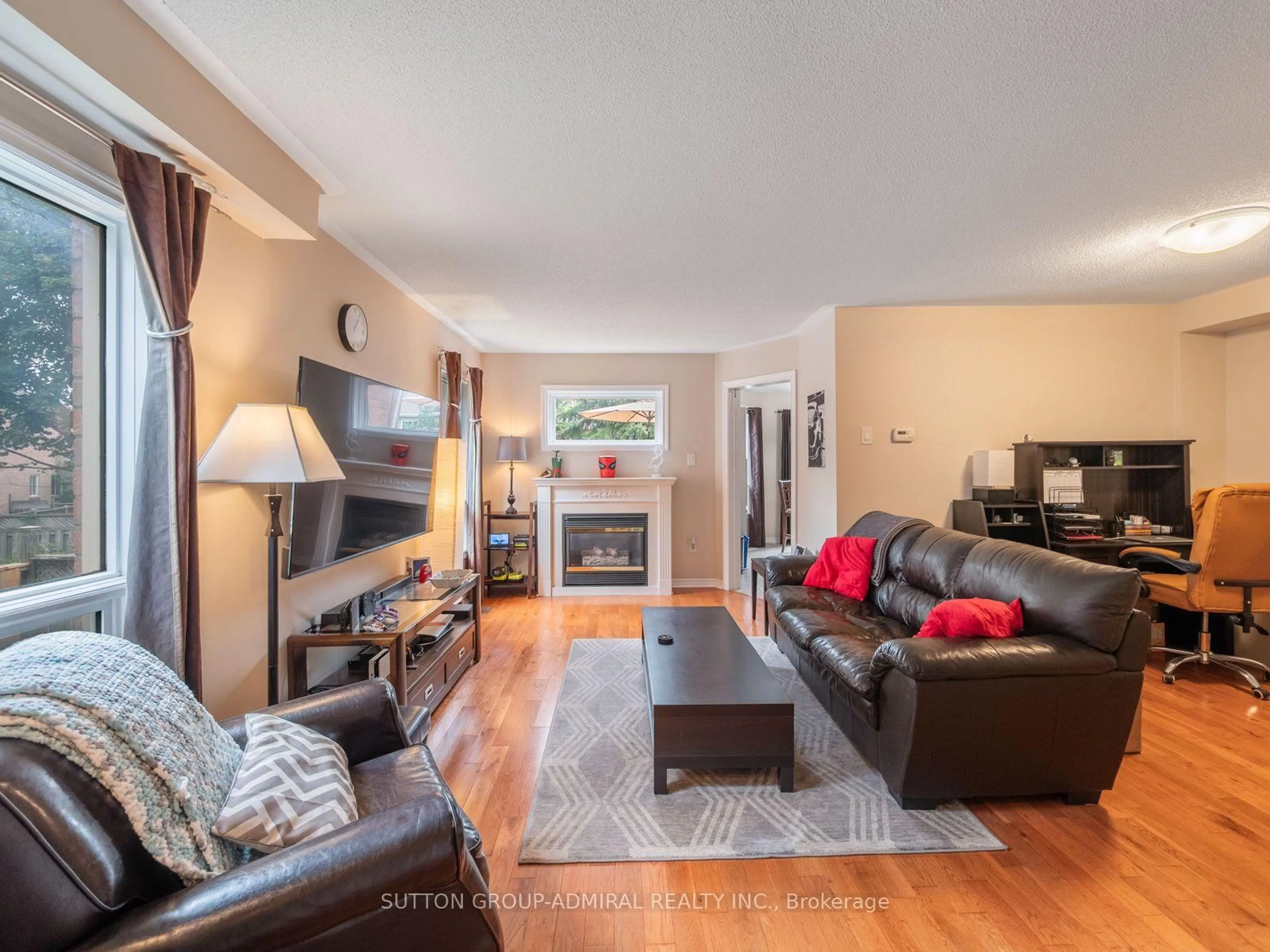 Living room with furniture, wood/laminate floor for 267 Warner Cres, Newmarket Ontario L3X 2G6