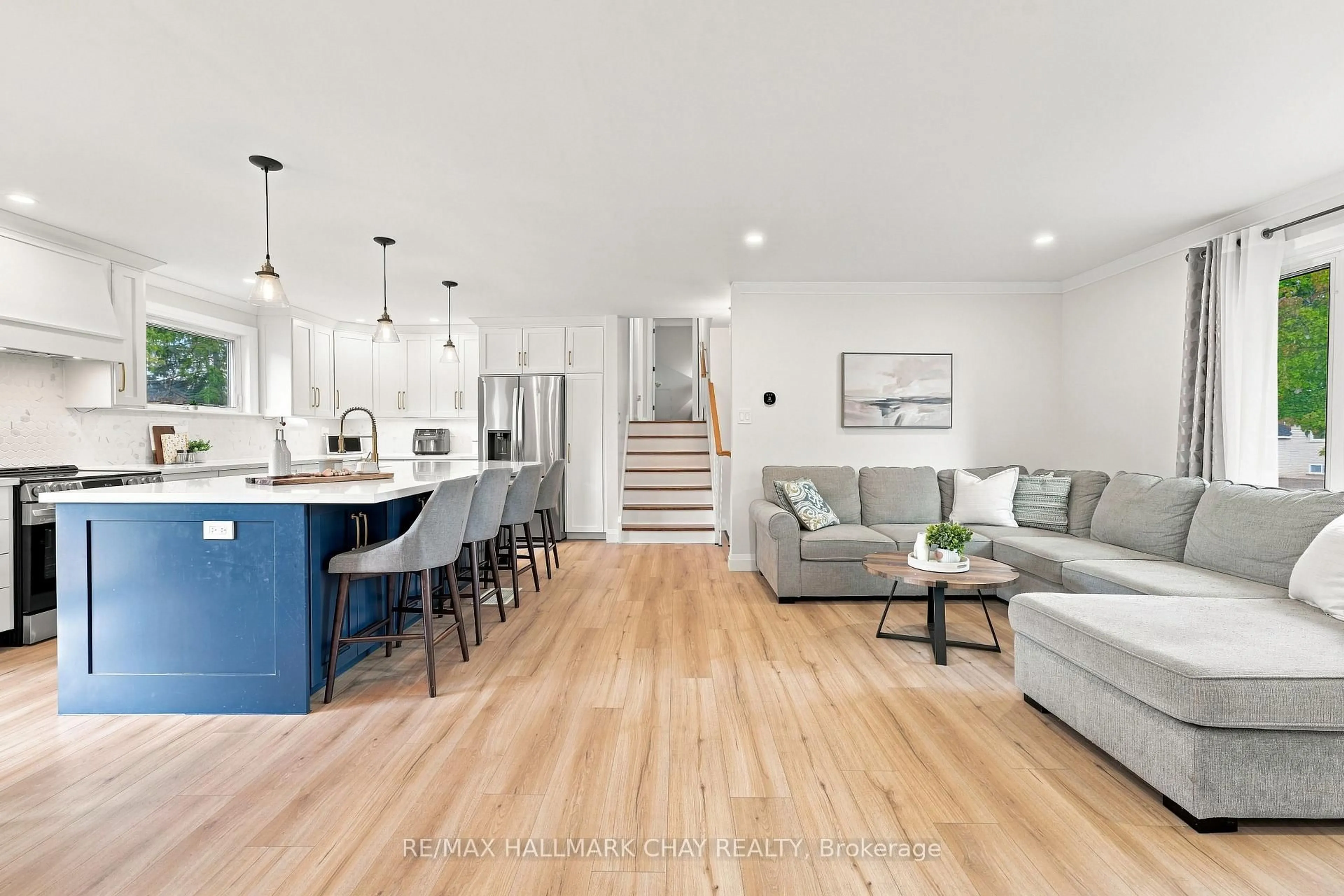 Open concept kitchen, wood/laminate floor for 12 Larkdale Cres, Essa Ontario L0M 1B0