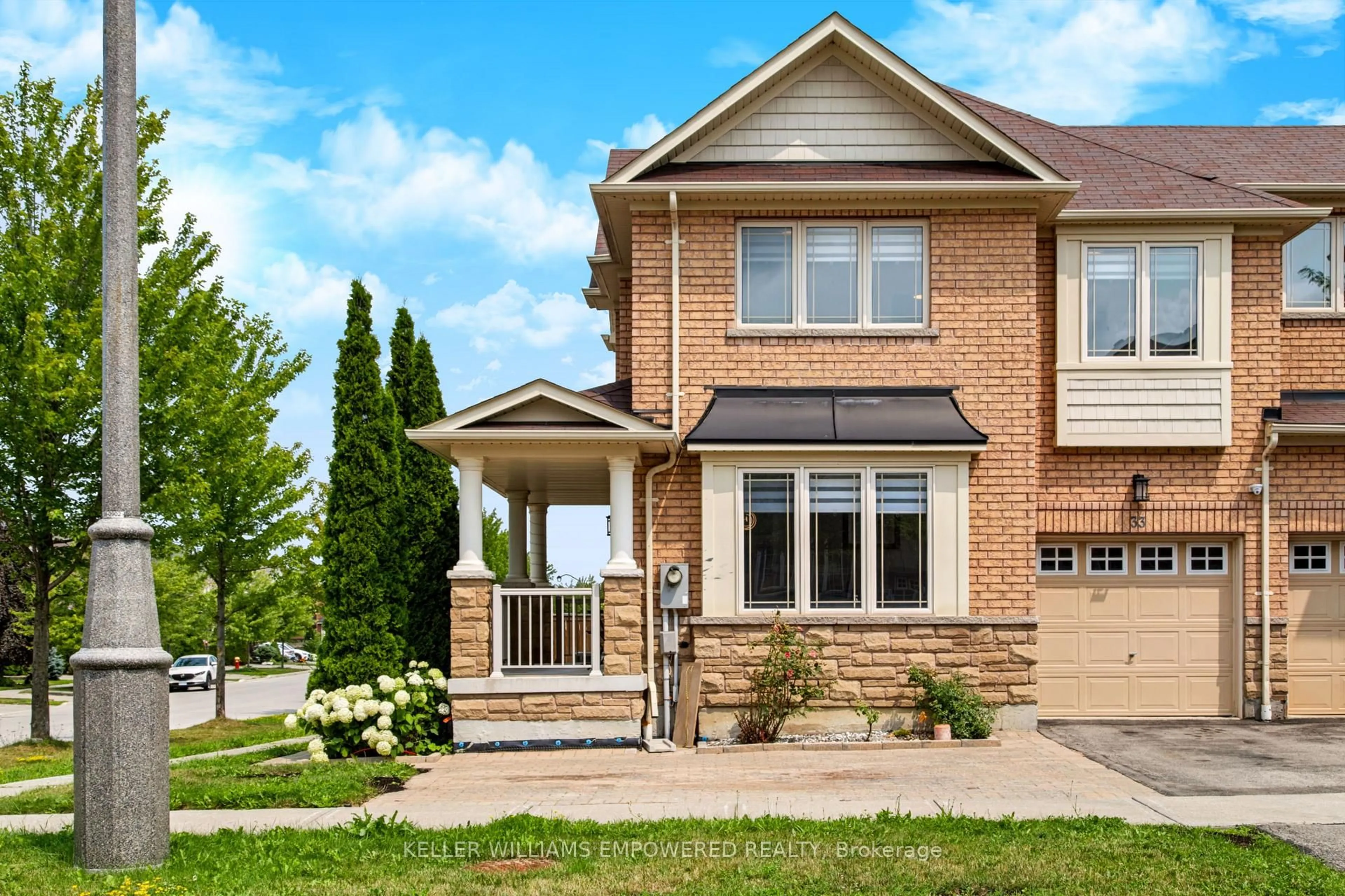 Home with brick exterior material, street for 33 Winisk St, Richmond Hill Ontario L4E 0L5