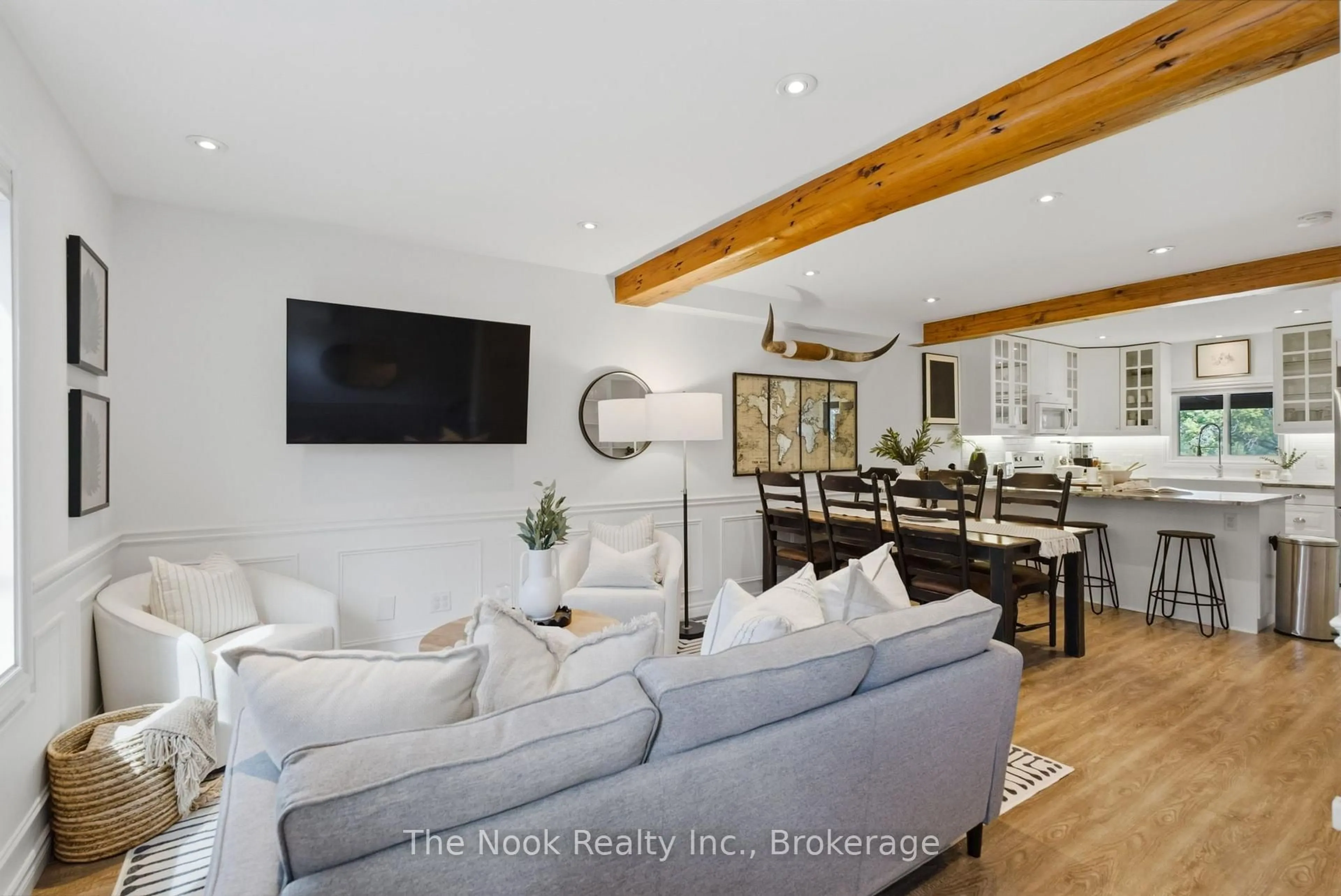 Living room with furniture, wood/laminate floor for 7168 Old Shiloh Rd, Georgina Ontario L0E 1N0