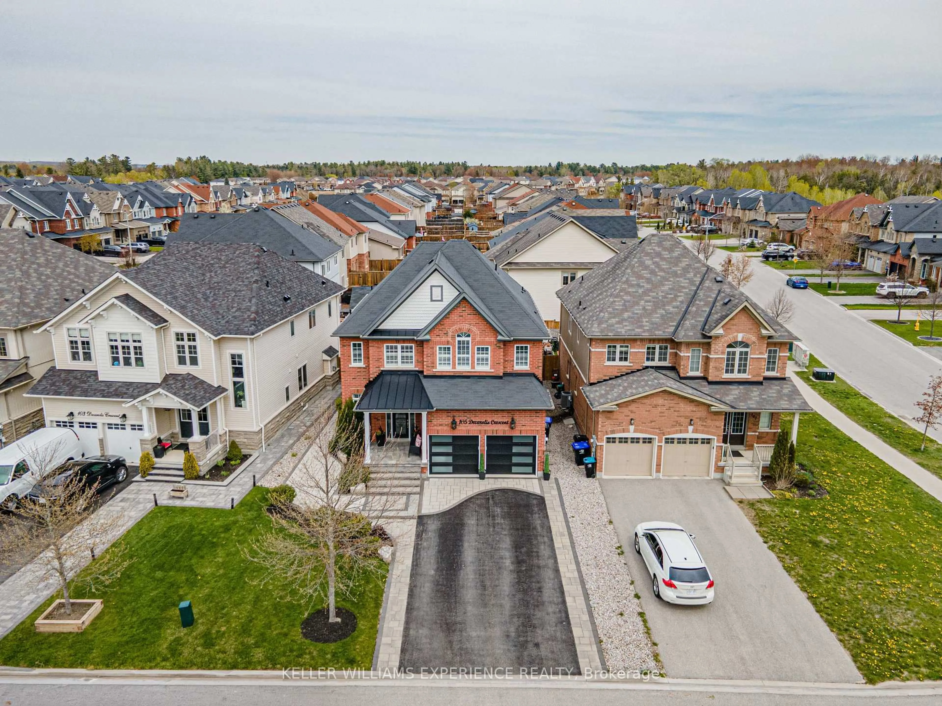 A pic from outside/outdoor area/front of a property/back of a property/a pic from drone, street for 105 DECAROLIS Cres, Essa Ontario L3W 0B4