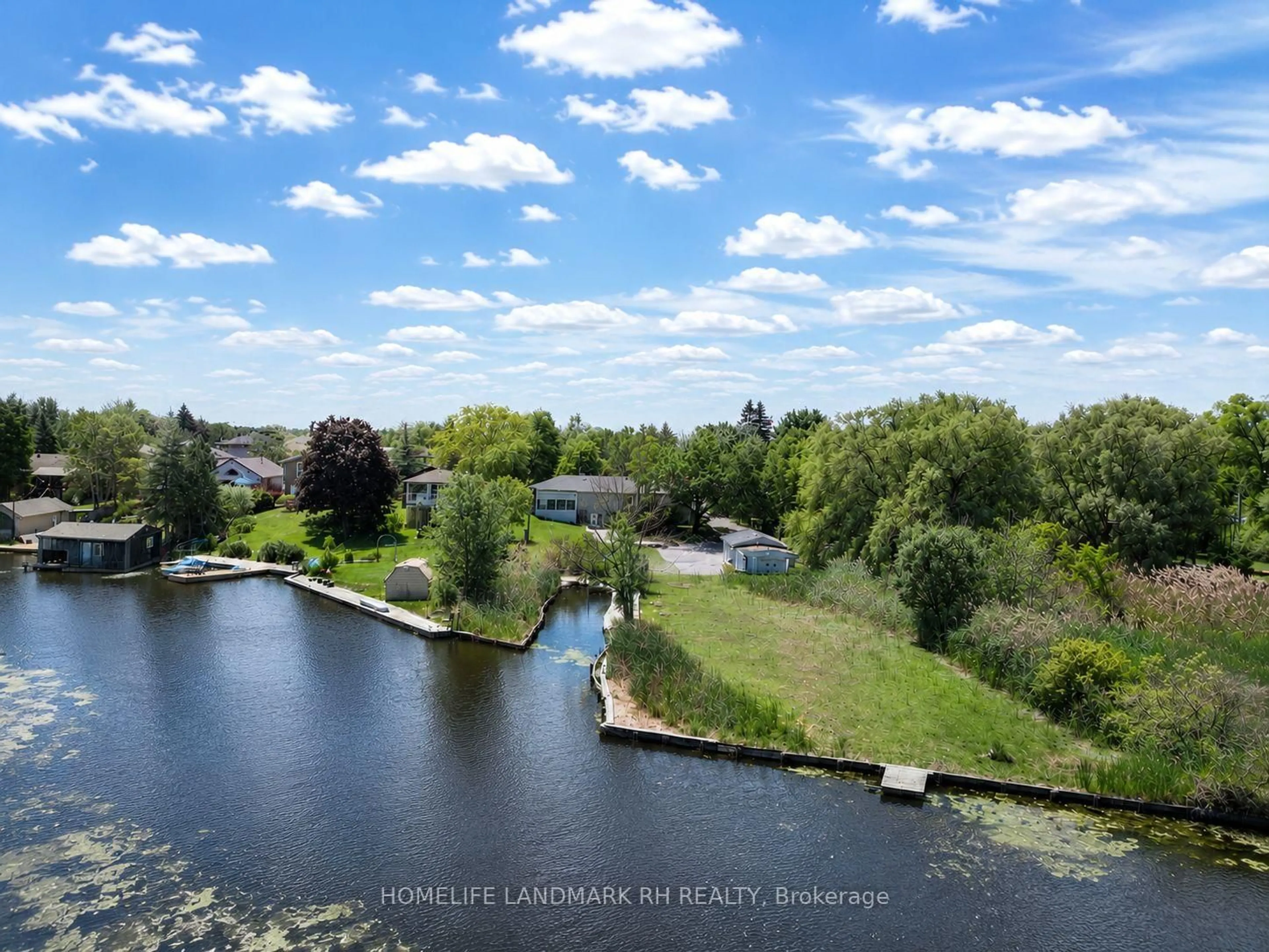 A pic from outside/outdoor area/front of a property/back of a property/a pic from drone, water/lake/river/ocean view for 88 Riverglen Dr, Georgina Ontario L4P 2R1