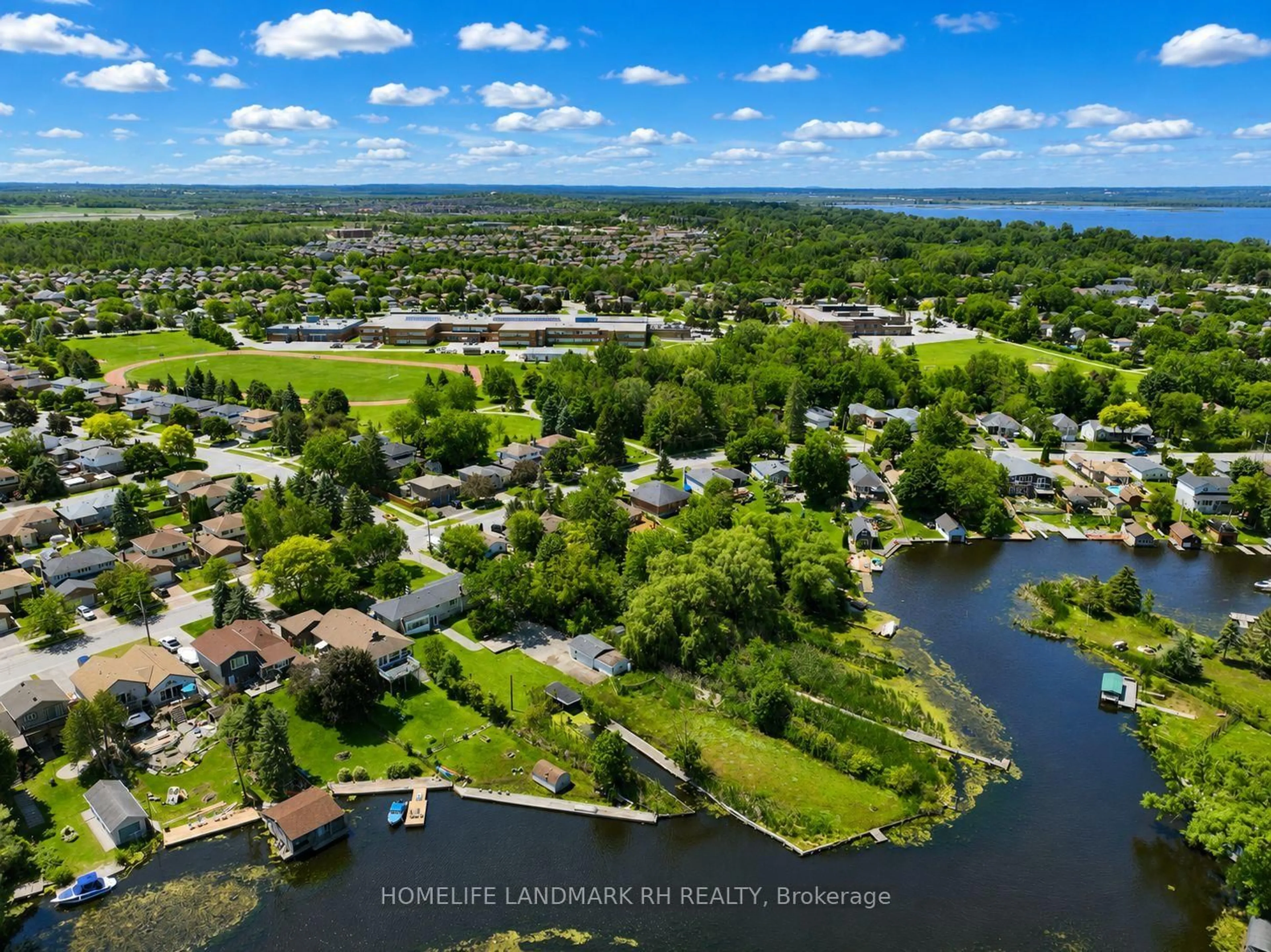 A pic from outside/outdoor area/front of a property/back of a property/a pic from drone, water/lake/river/ocean view for 88 Riverglen Dr, Georgina Ontario L4P 2R1