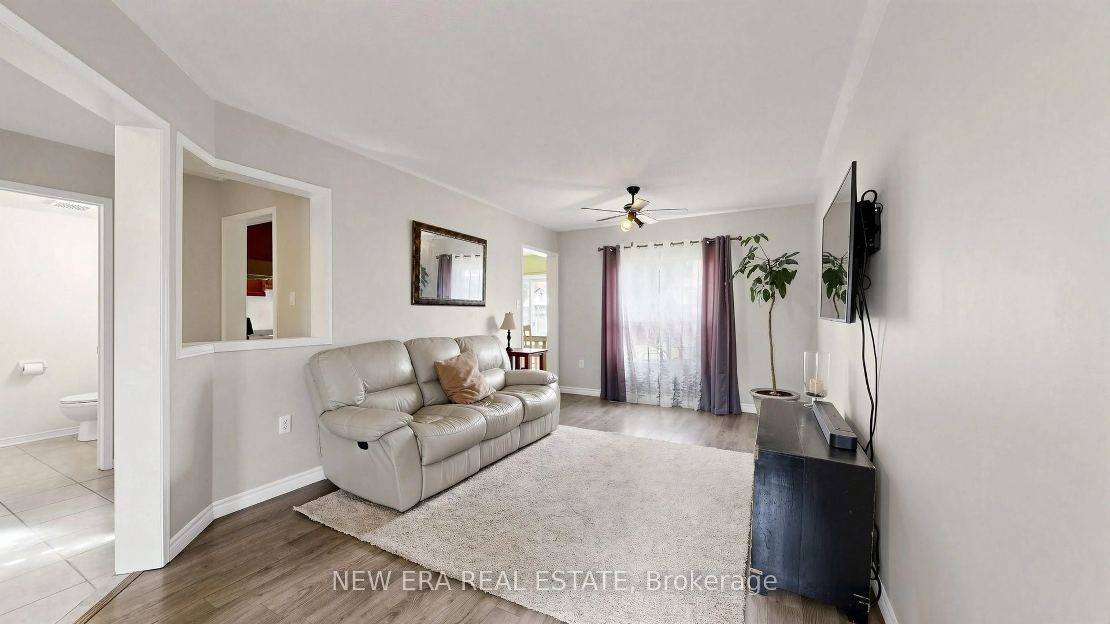 Living room with furniture, ceramic/tile floor for 28 Preston Ave, New Tecumseth Ontario L9R 1Y6