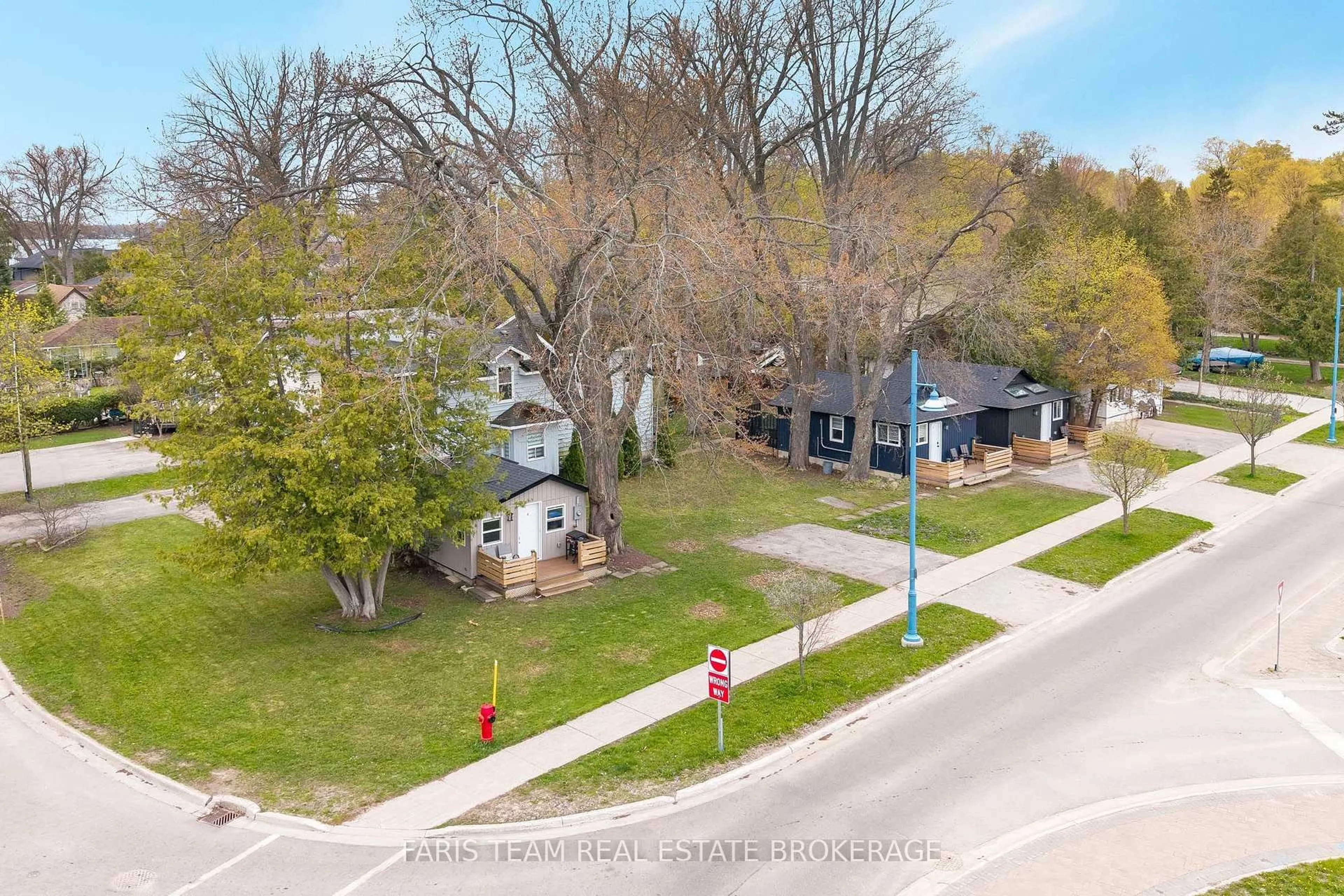 A pic from outside/outdoor area/front of a property/back of a property/a pic from drone, street for 687 Innisfil Beach Road, Innisfil Ontario L0L 2M0