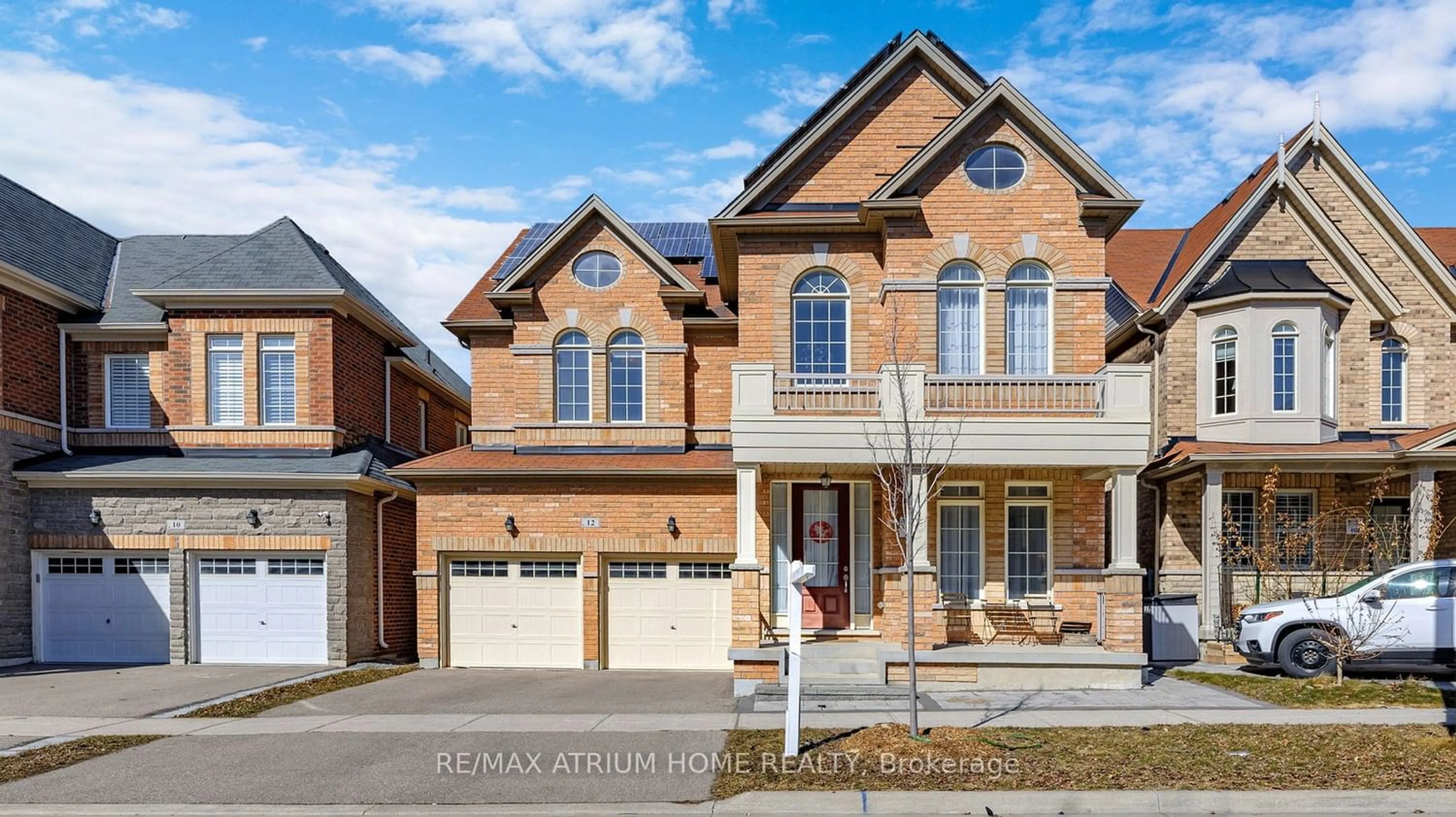 Home with brick exterior material for 12 Hubner Ave, Markham Ontario L6C 0S8