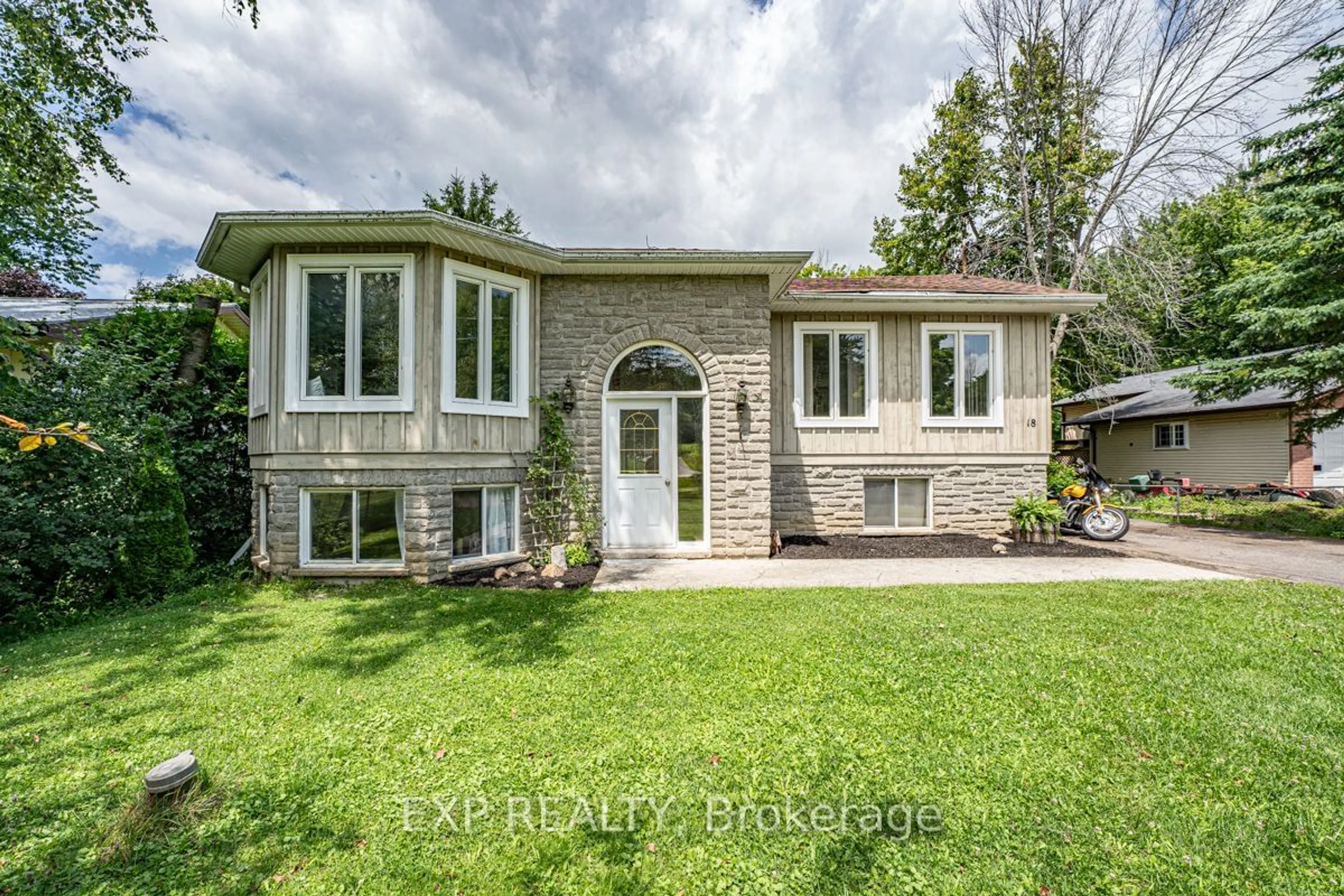 Frontside or backside of a home for 18 Mums Ave, Georgina Ontario L0E 1R0