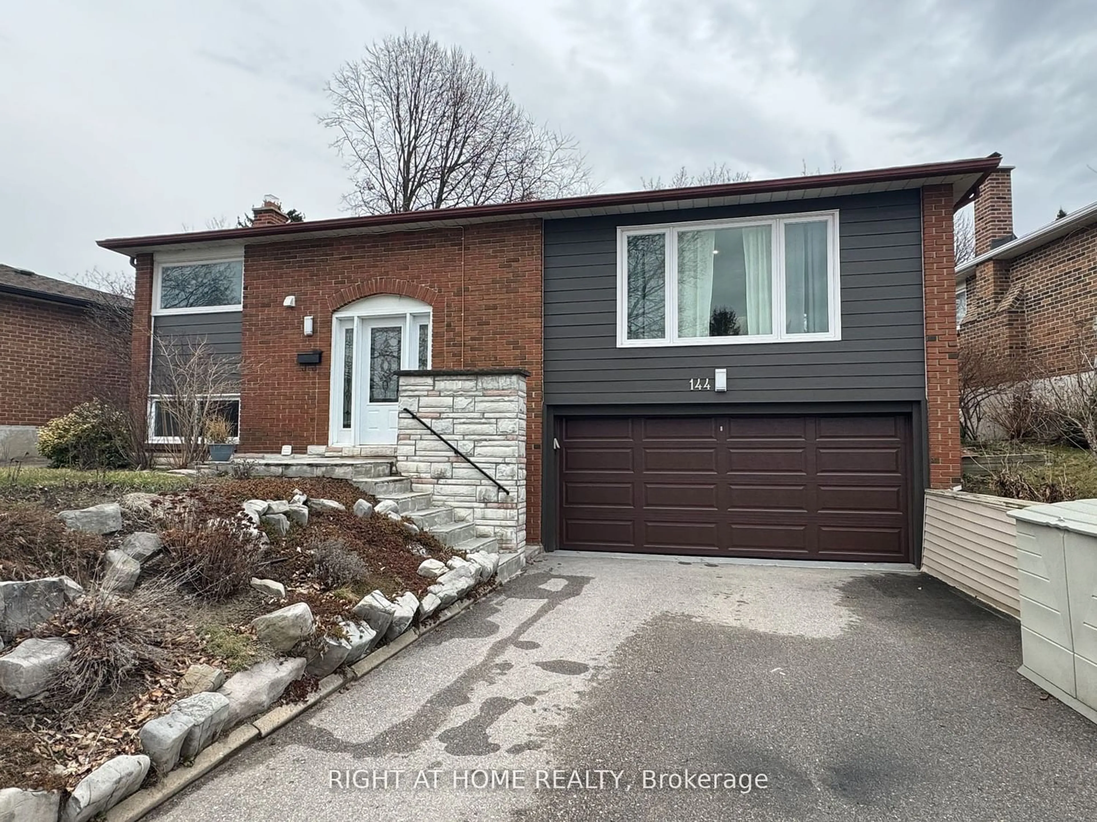 Frontside or backside of a home for 144 Romfield Crct, Markham Ontario L3T 3H9
