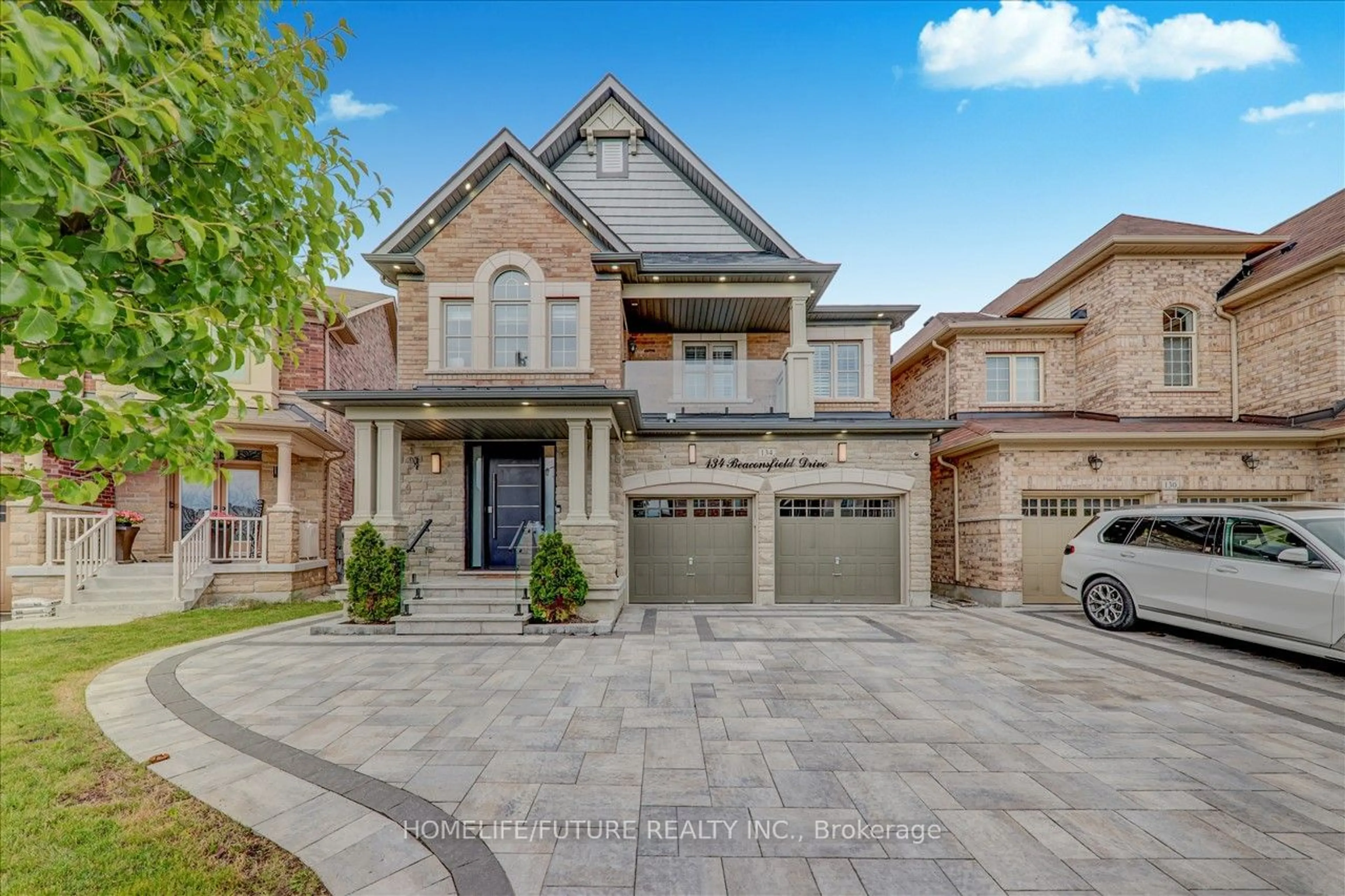 Home with brick exterior material for 134 Beaconsfiled Dr, Vaughan Ontario L4H 4L6