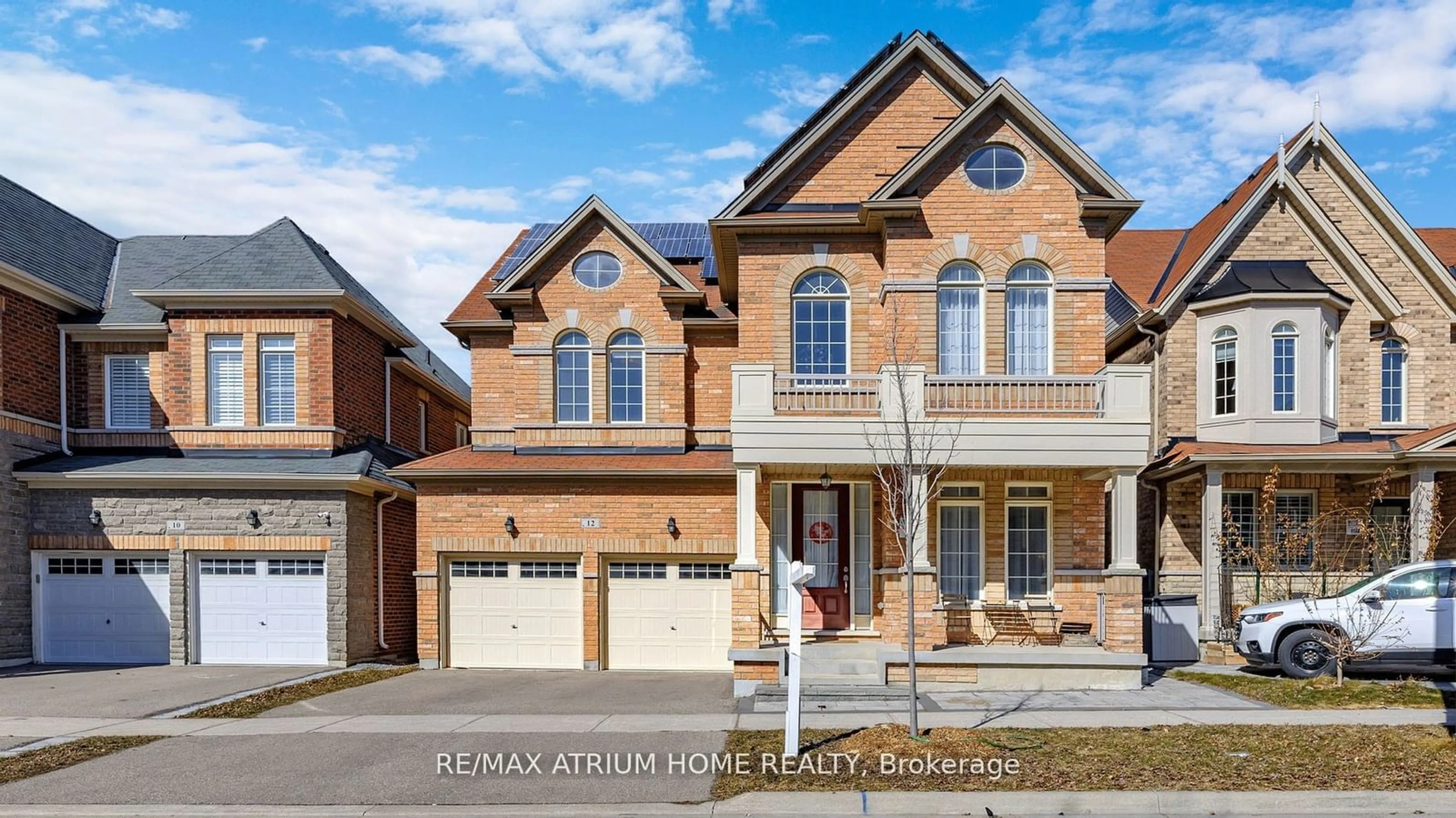 Home with brick exterior material for 12 Hubner Ave, Markham Ontario L6C 0S8