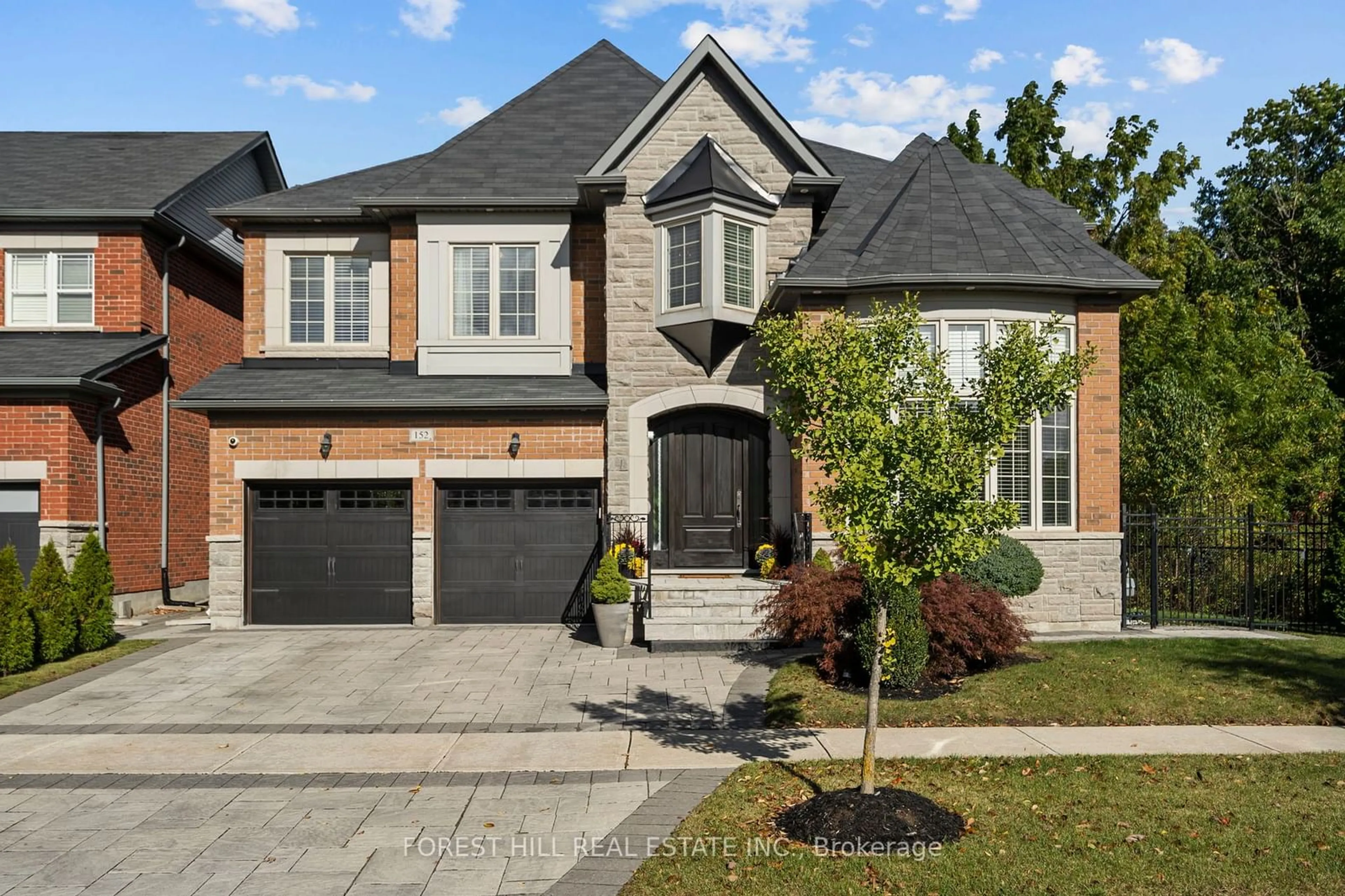 Home with brick exterior material for 152 Riding Mountain Dr, Richmond Hill Ontario L4E 0T9