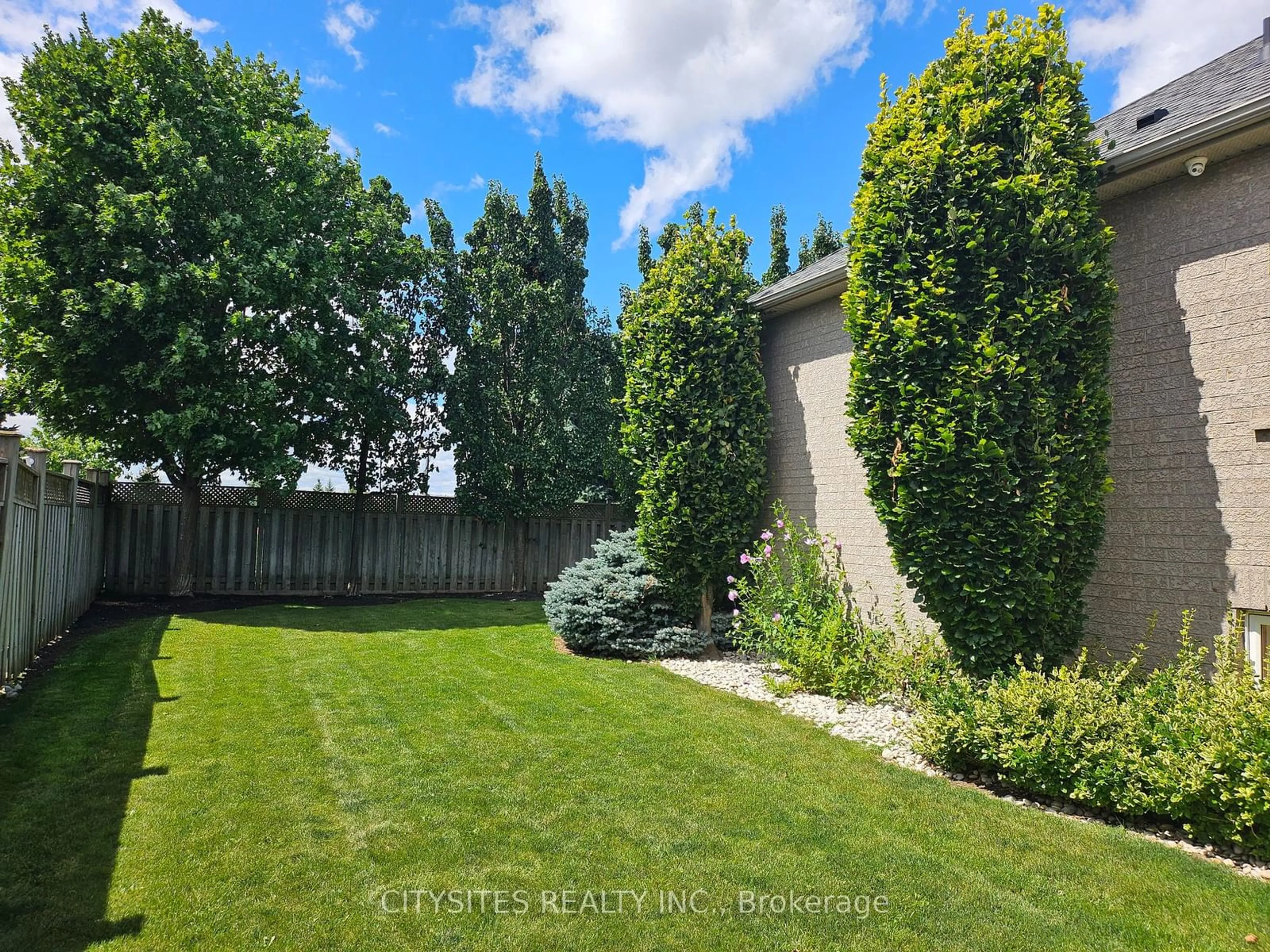 A pic from exterior of the house or condo, the fenced backyard for 135 Michelle Dr, Vaughan Ontario L4L 9E1