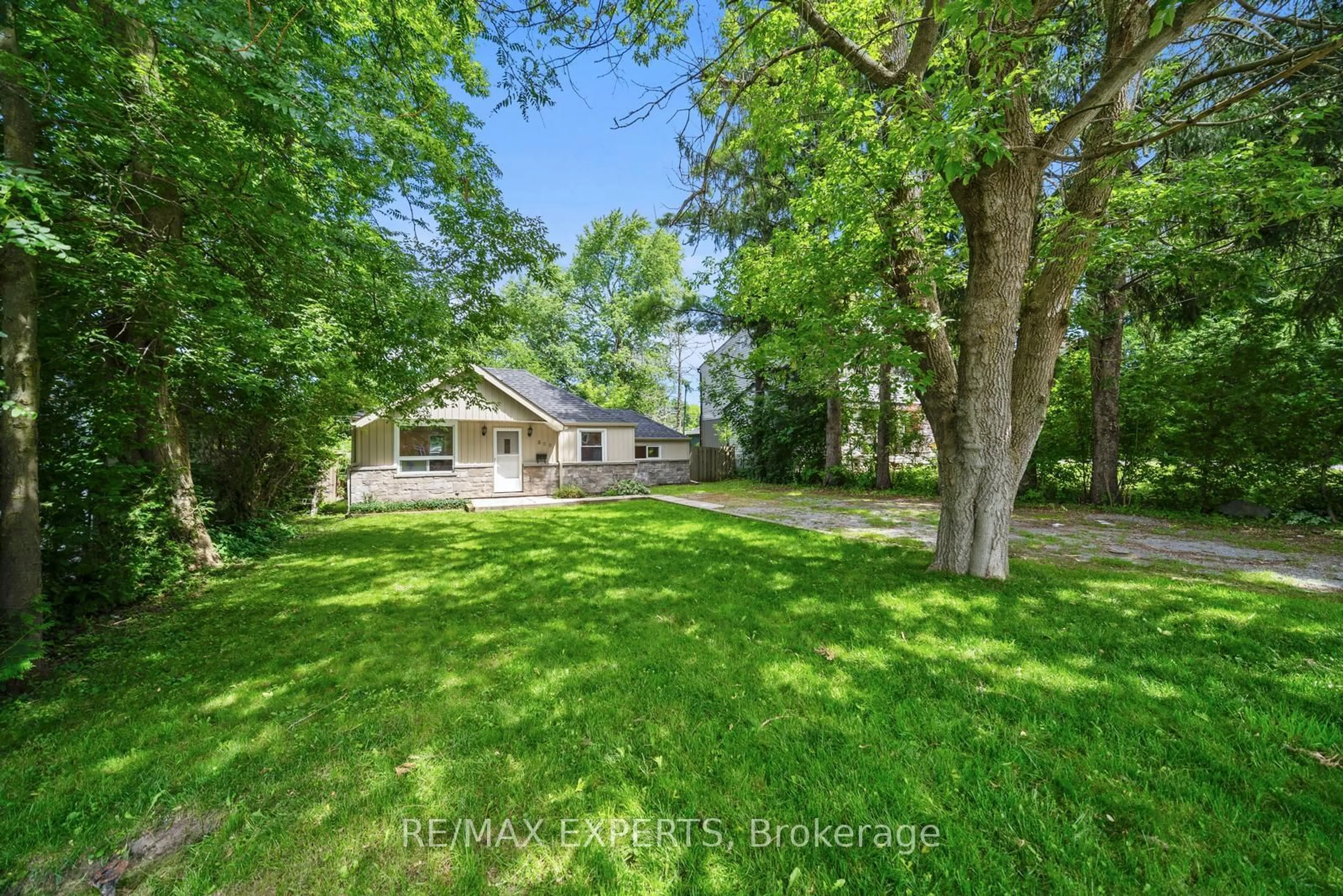 Frontside or backside of a home, the fenced backyard for 302 Hollywood Dr, Georgina Ontario L4P 2Z8