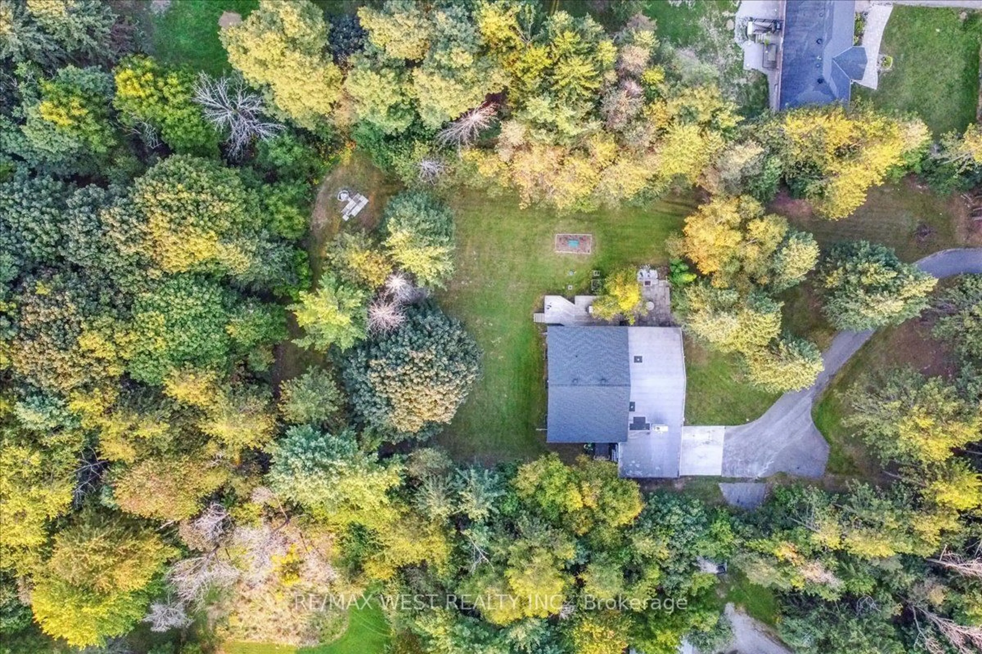 A pic from exterior of the house or condo, the fenced backyard for 3600 16th Sideroad, King Ontario L7B 1K4