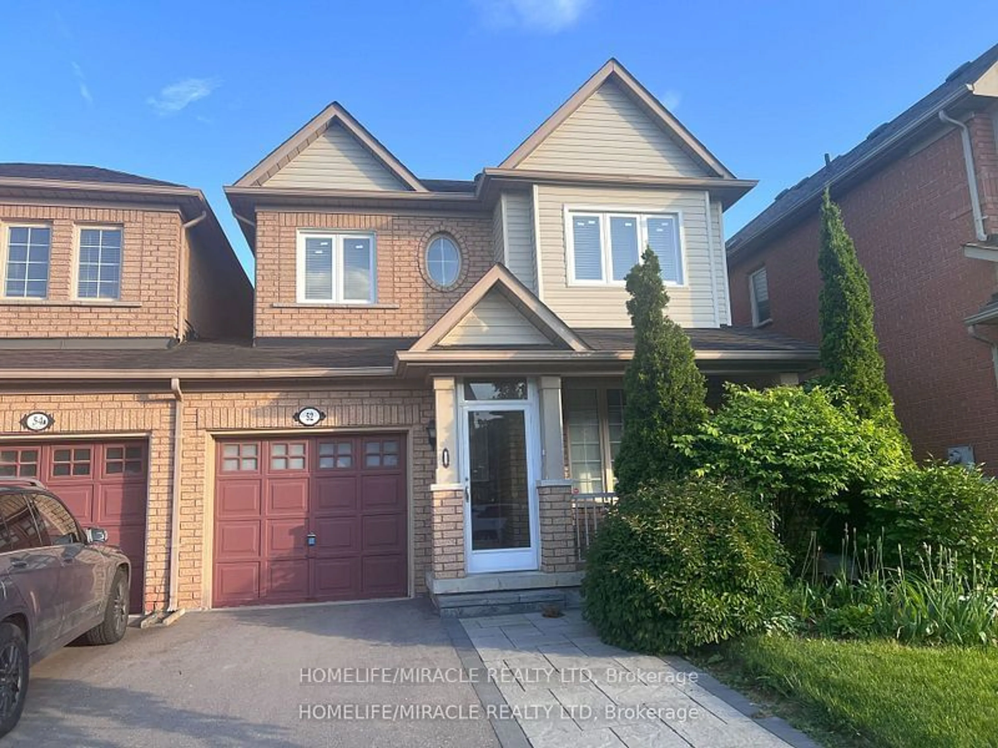 Frontside or backside of a home, the street view for 52 Cider Cres, Richmond Hill Ontario L4E 4A4