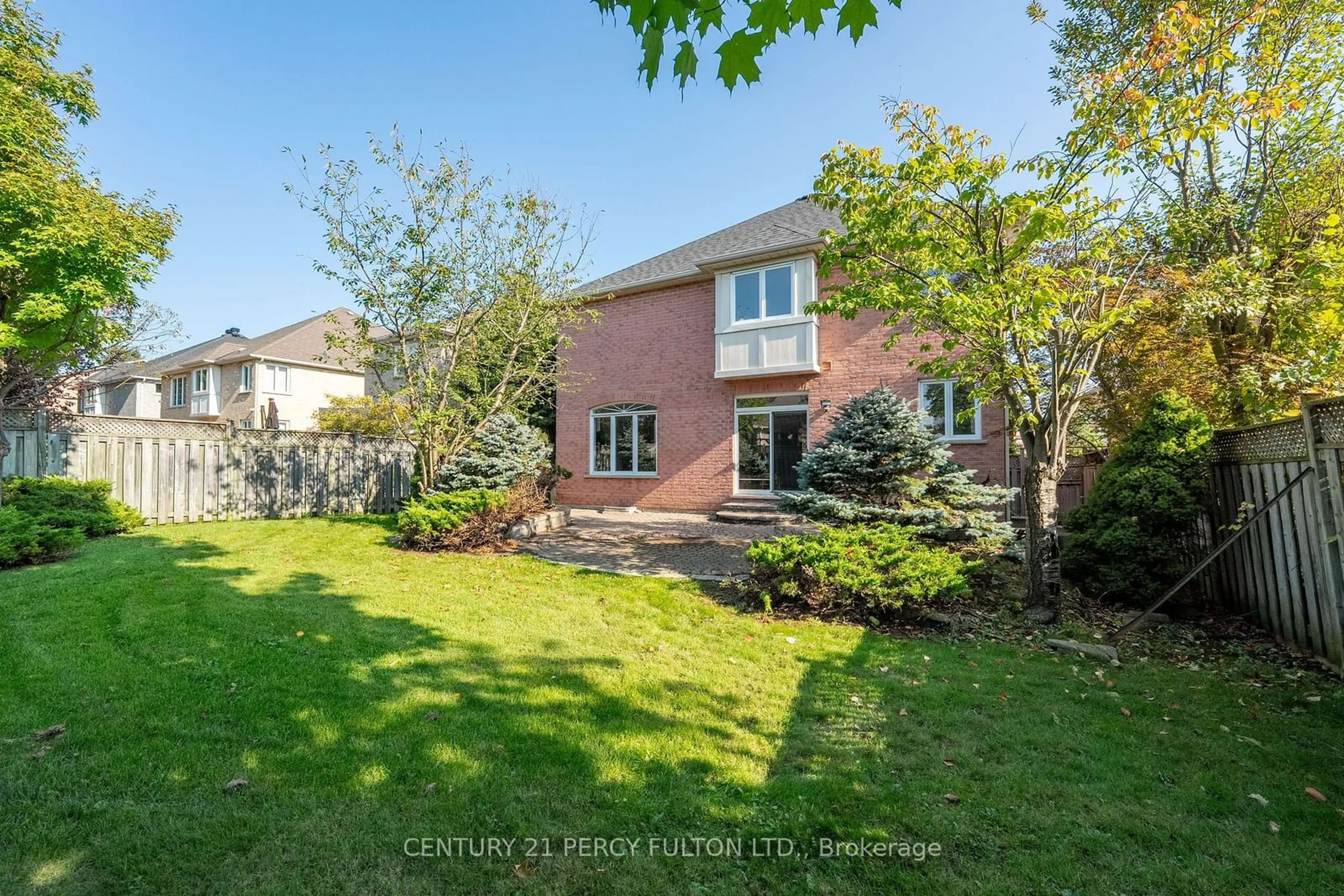 Frontside or backside of a home, the fenced backyard for 10 Burndenford Cres, Markham Ontario L3P 7Z3