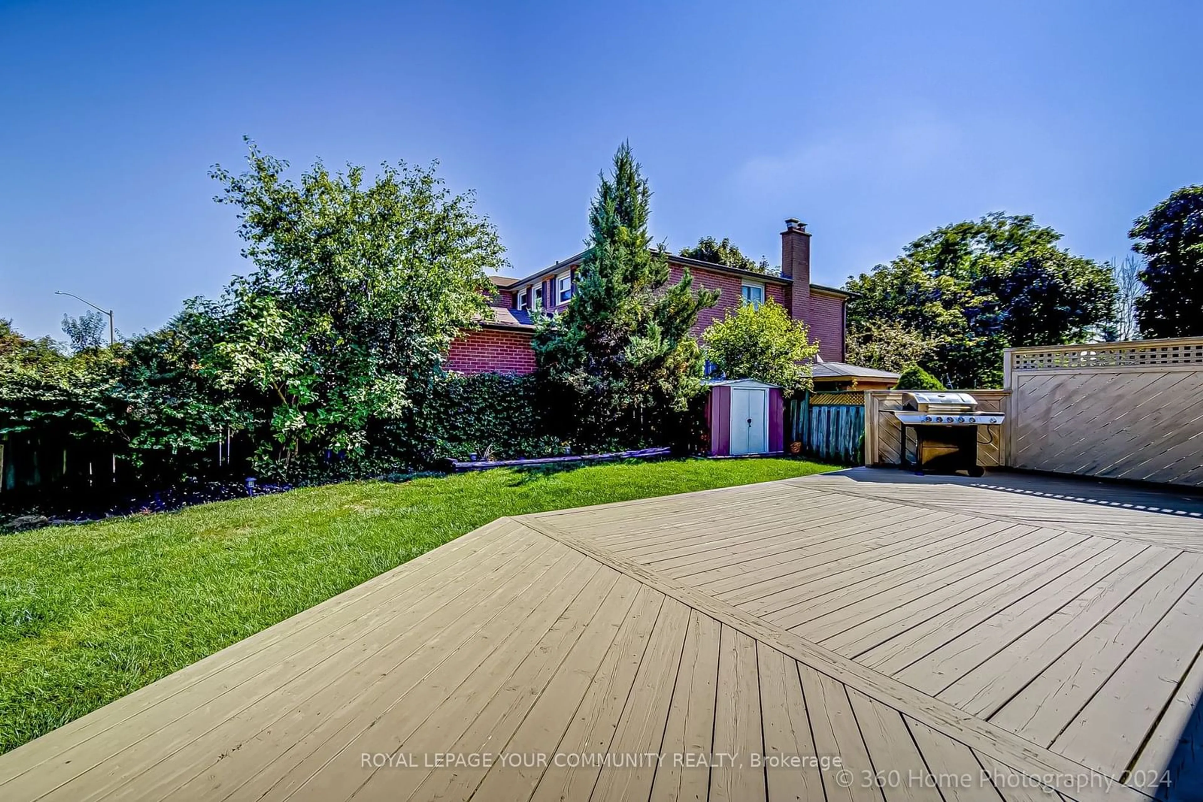 Frontside or backside of a home, the fenced backyard for 53 Marsh St, Richmond Hill Ontario L4C 7R6