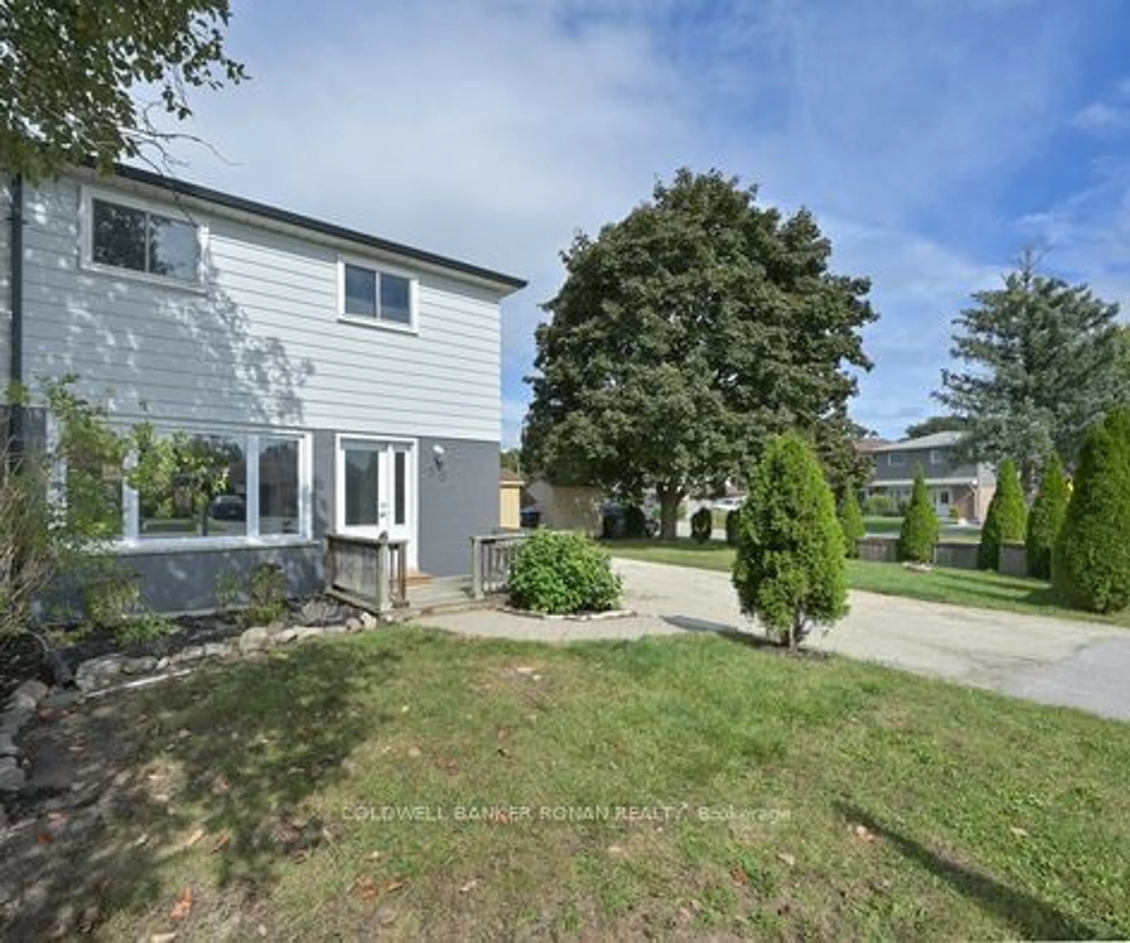 Frontside or backside of a home, the fenced backyard for 20 Eastern Ave, New Tecumseth Ontario L0G 1W0