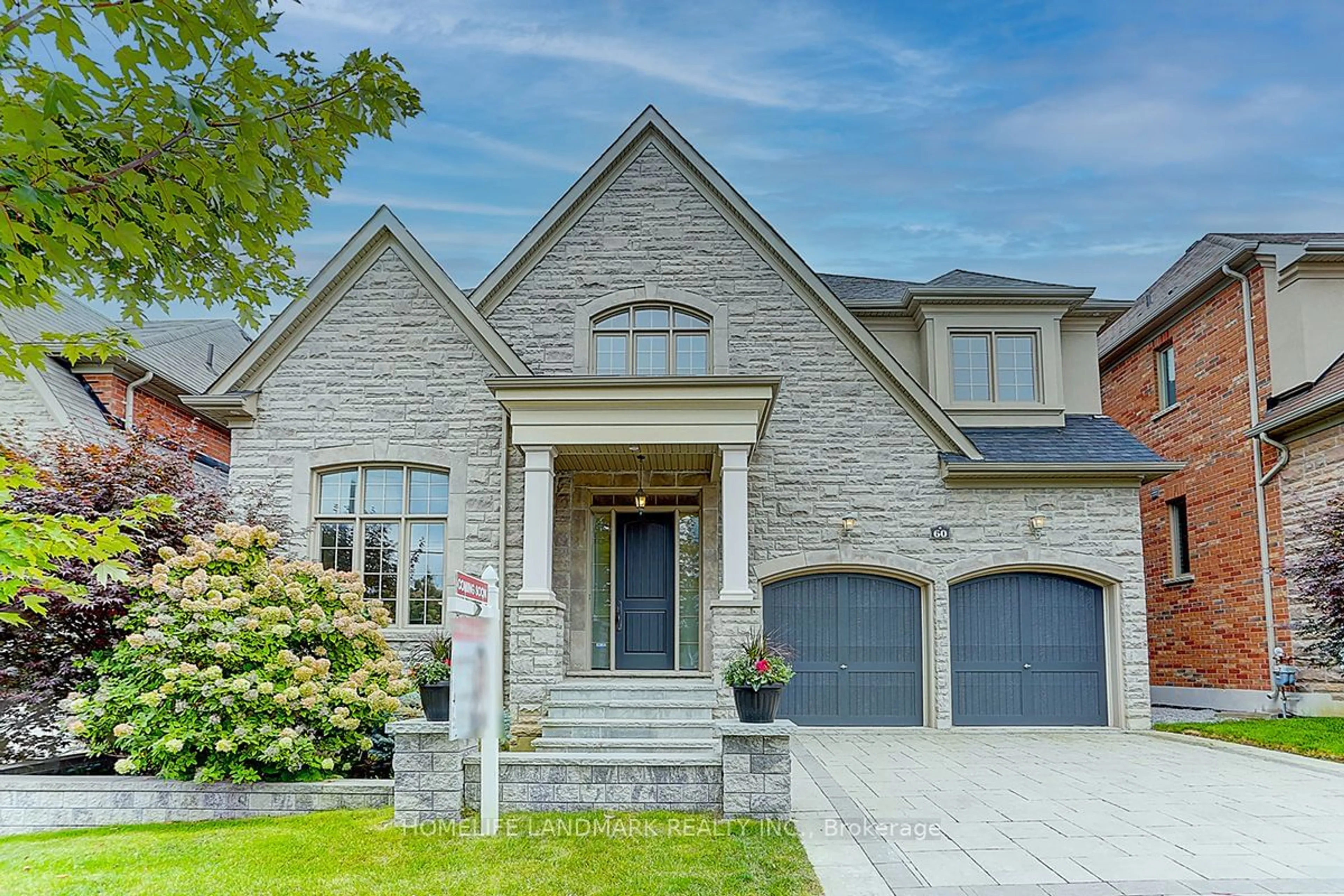 Home with brick exterior material for 60 Royal West Rd, Markham Ontario L6C 0L5