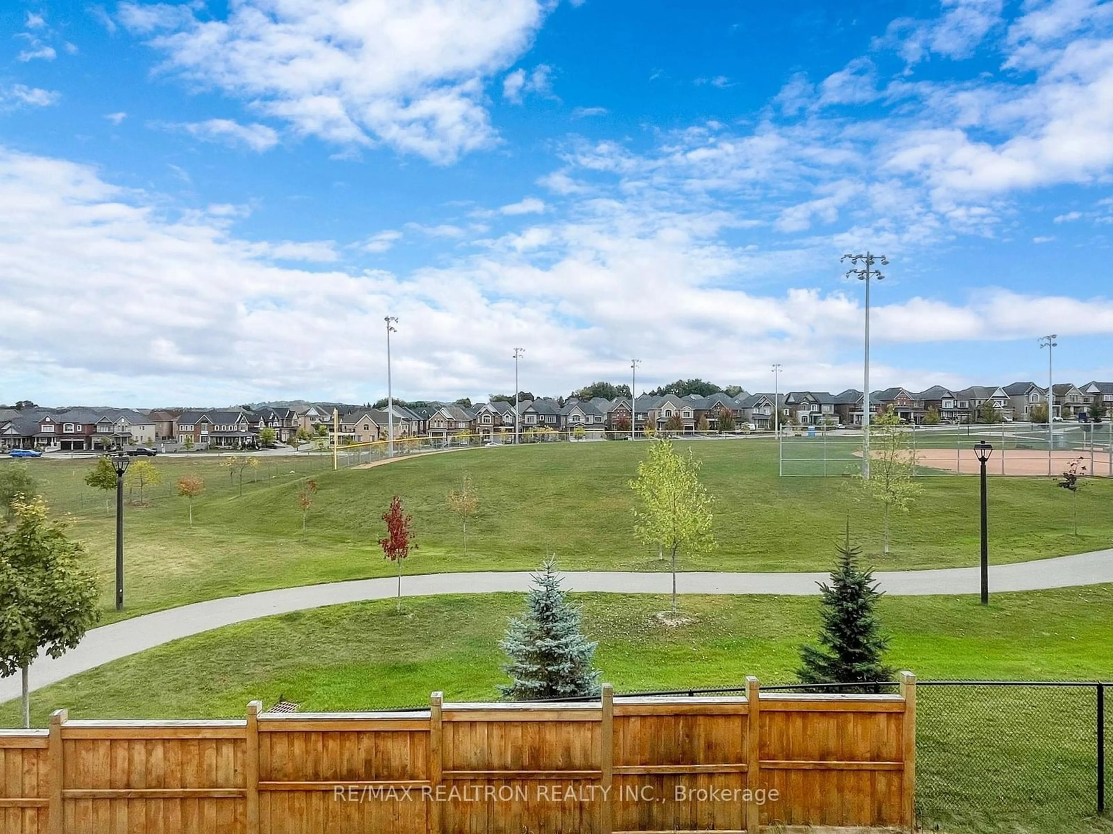 A pic from exterior of the house or condo, the fenced backyard for 130 Frank Kelly Dr, East Gwillimbury Ontario L9N 0V1