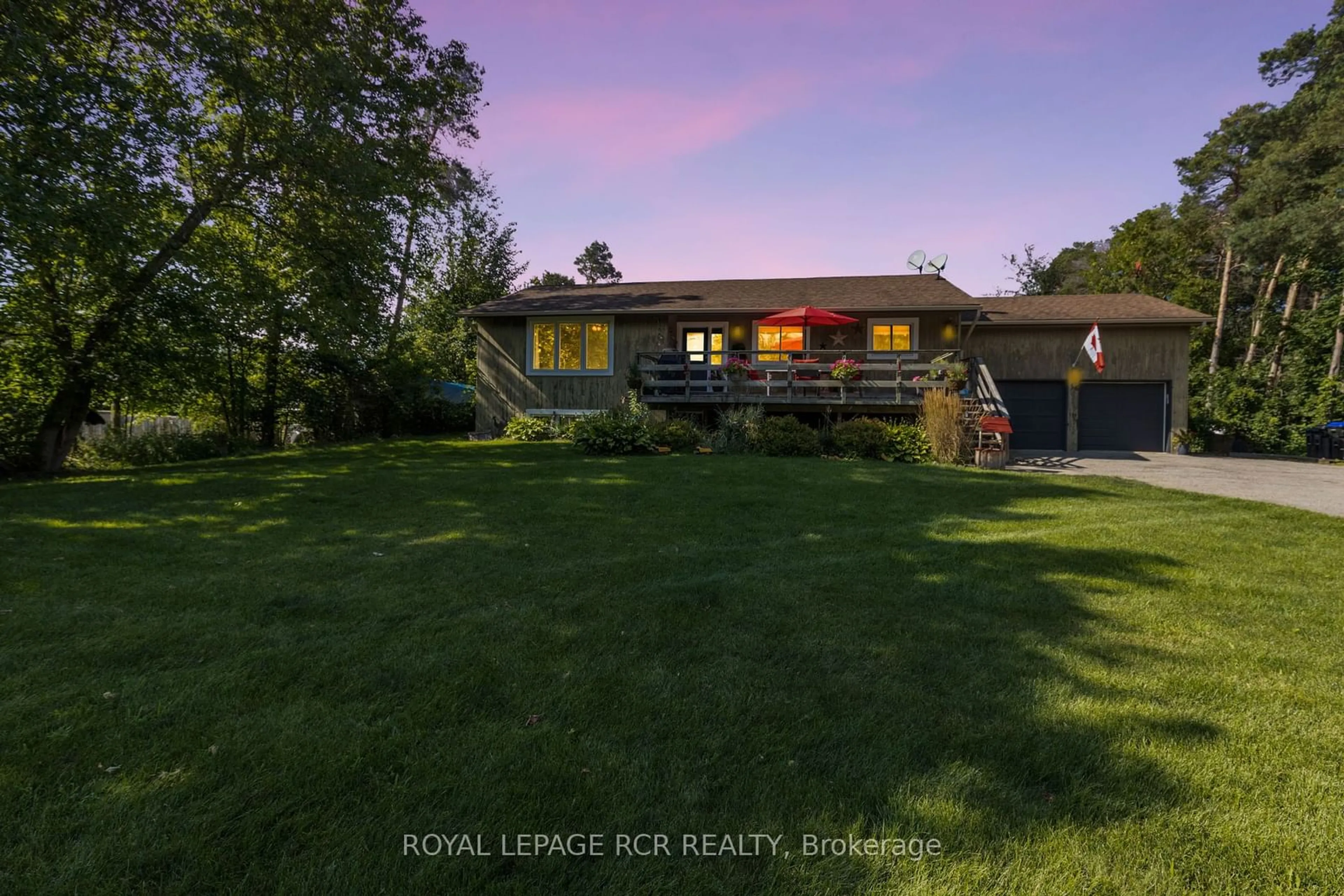 Frontside or backside of a home, the fenced backyard for 56 Maple Ave, Adjala-Tosorontio Ontario L0M 1K0