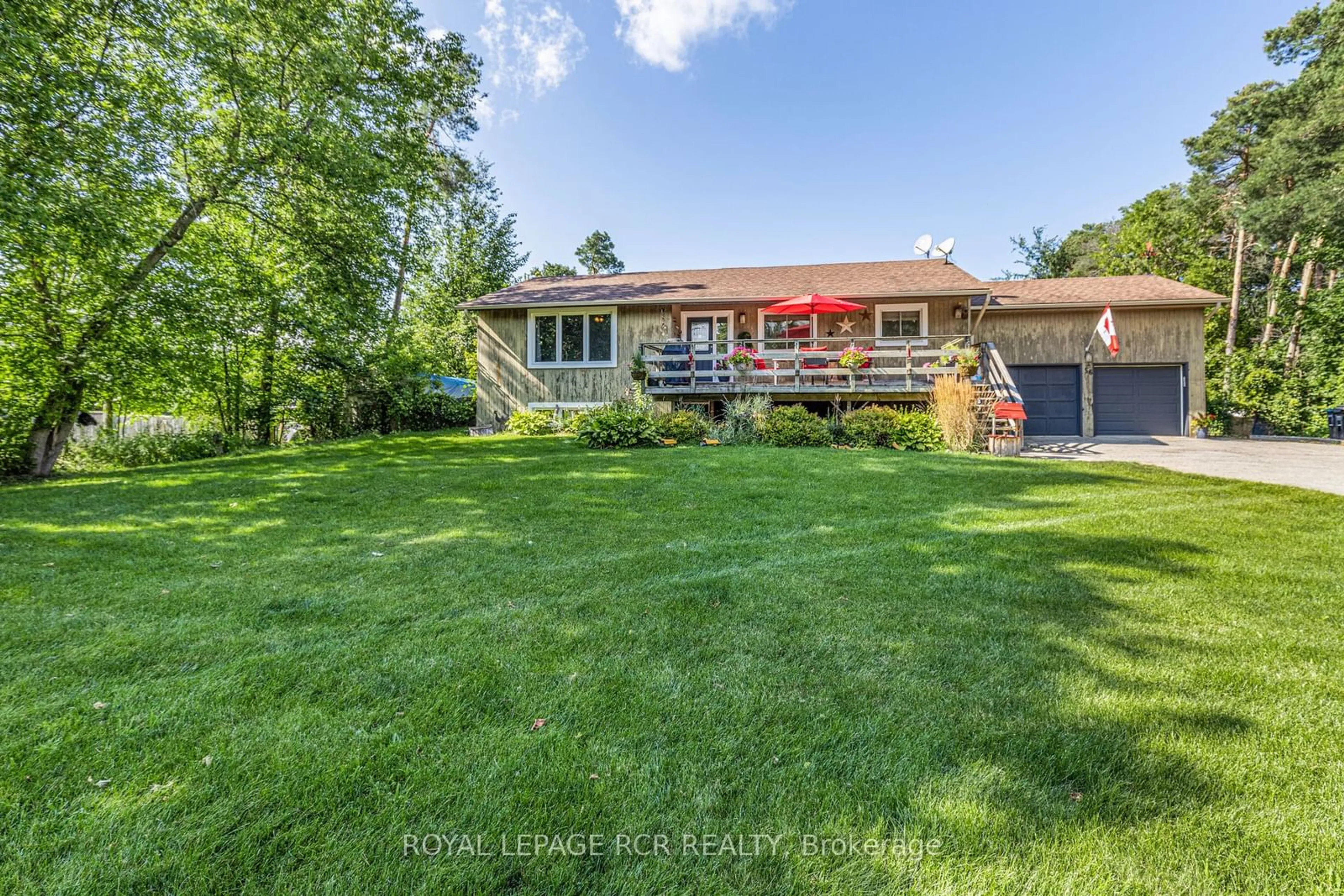 Frontside or backside of a home, the fenced backyard for 56 Maple Ave, Adjala-Tosorontio Ontario L0M 1K0