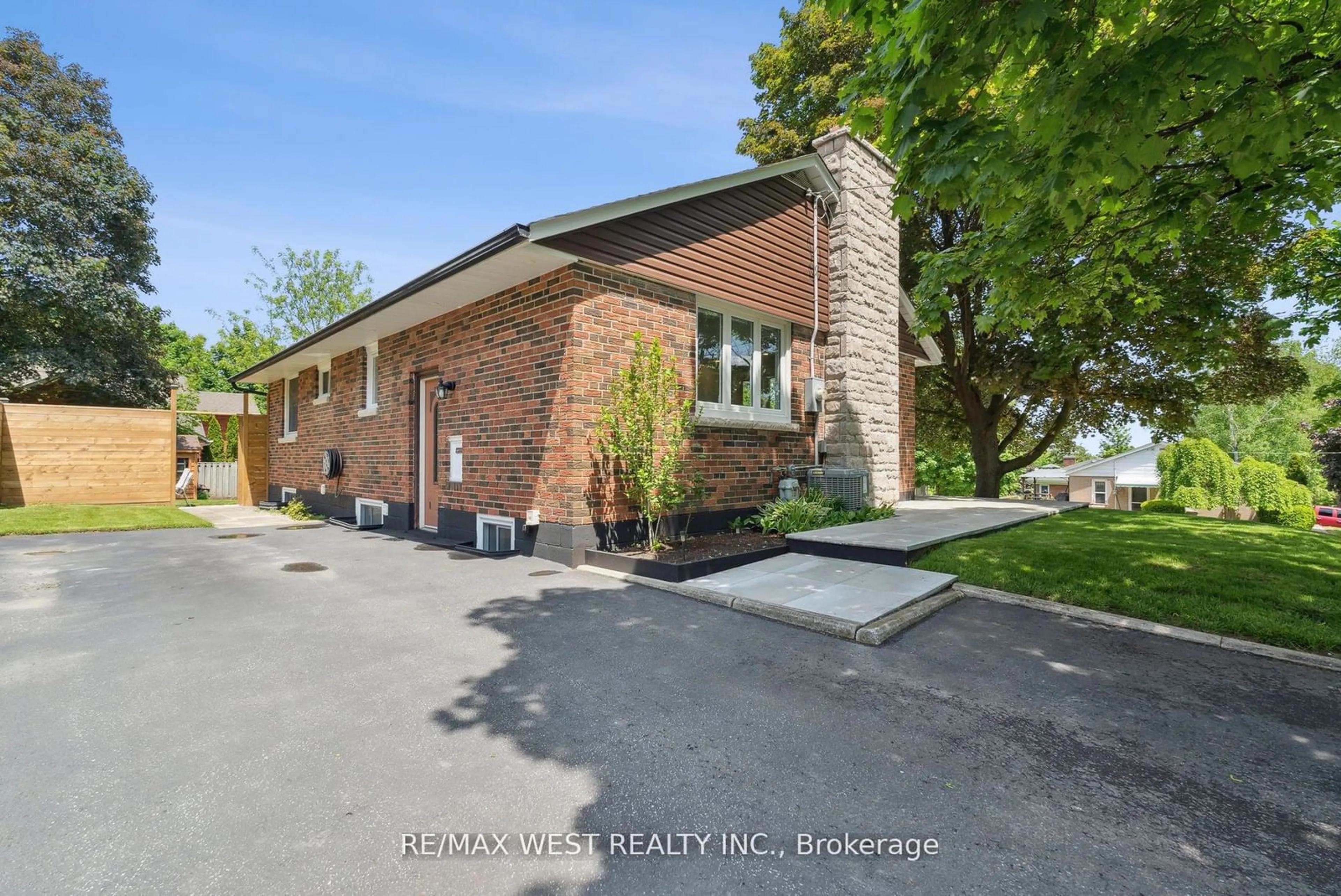 A pic from exterior of the house or condo, the fenced backyard for 308 Donlin Ave, Newmarket Ontario L3Y 4T6