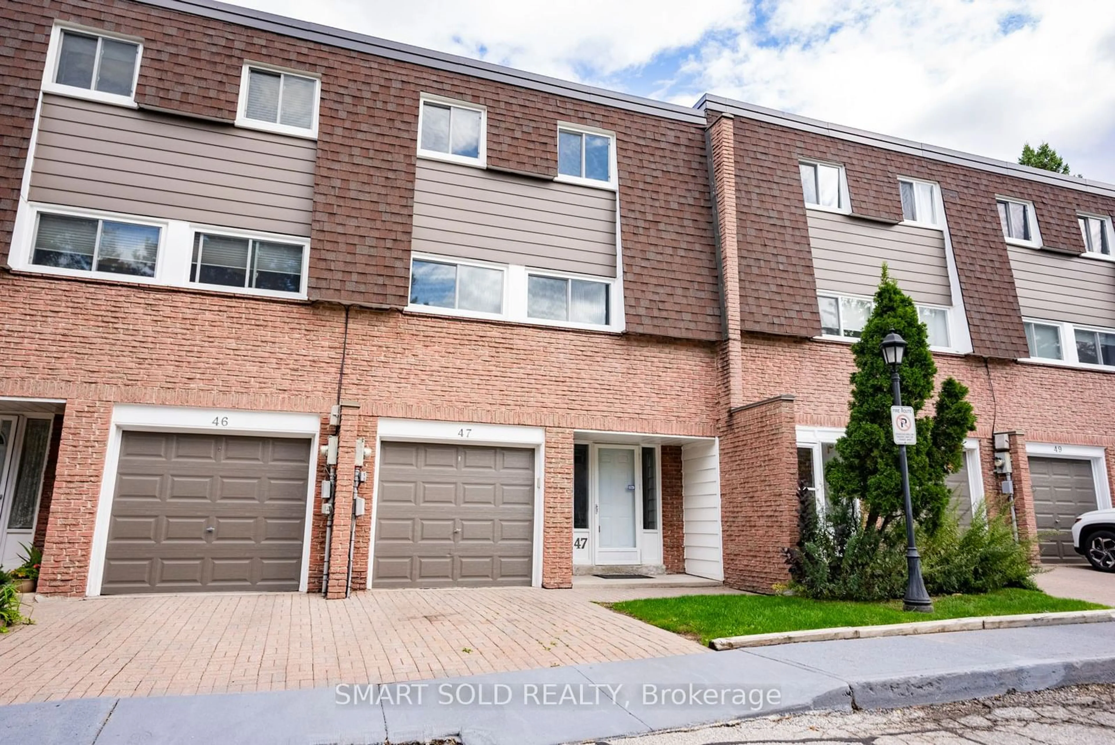 A pic from exterior of the house or condo, the street view for 653 Village Pkwy #47, Markham Ontario L3R 2R2