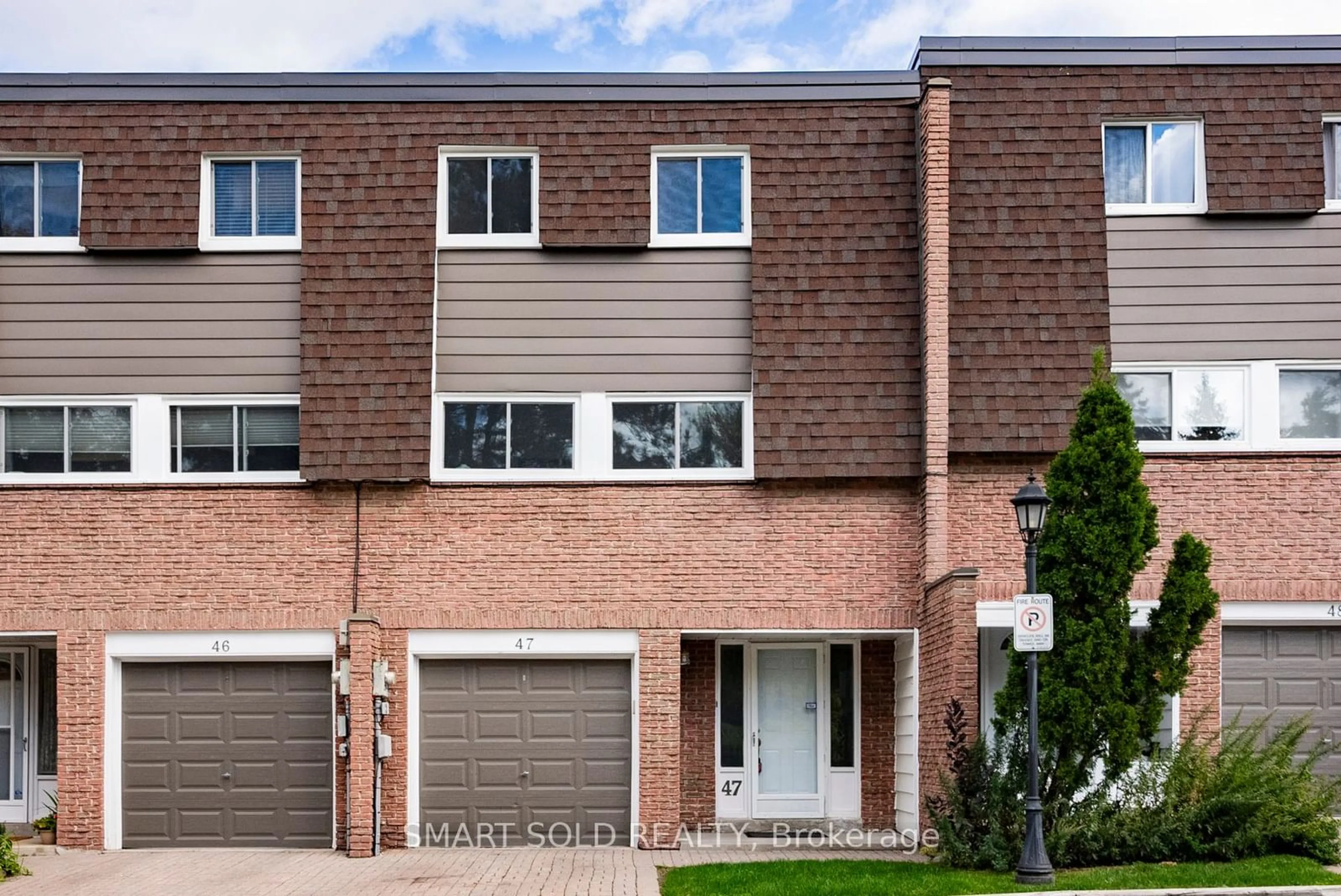 A pic from exterior of the house or condo, the front or back of building for 653 Village Pkwy #47, Markham Ontario L3R 2R2