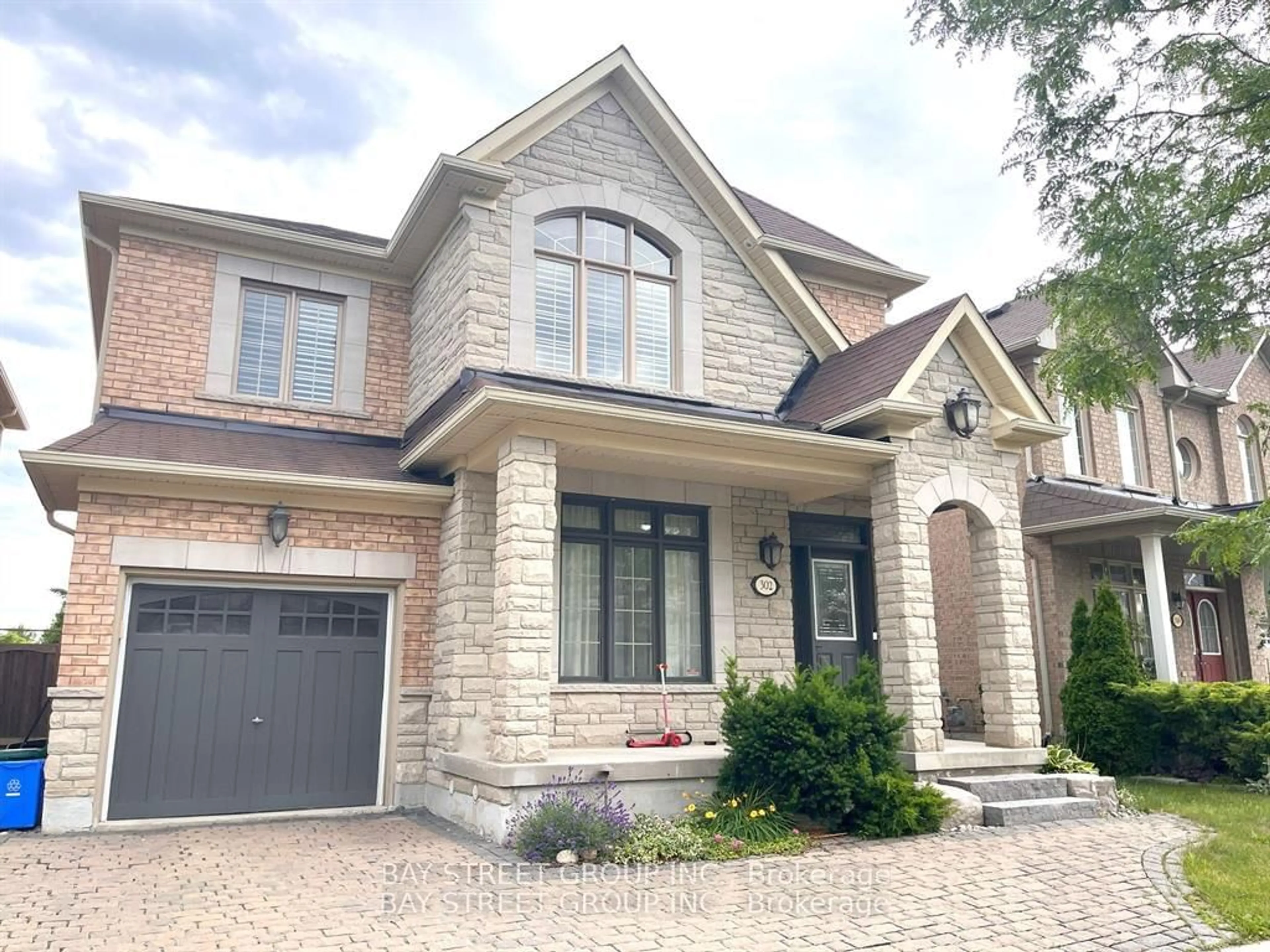 Home with brick exterior material for 302 Hammersly Blvd, Markham Ontario L6E 2C4