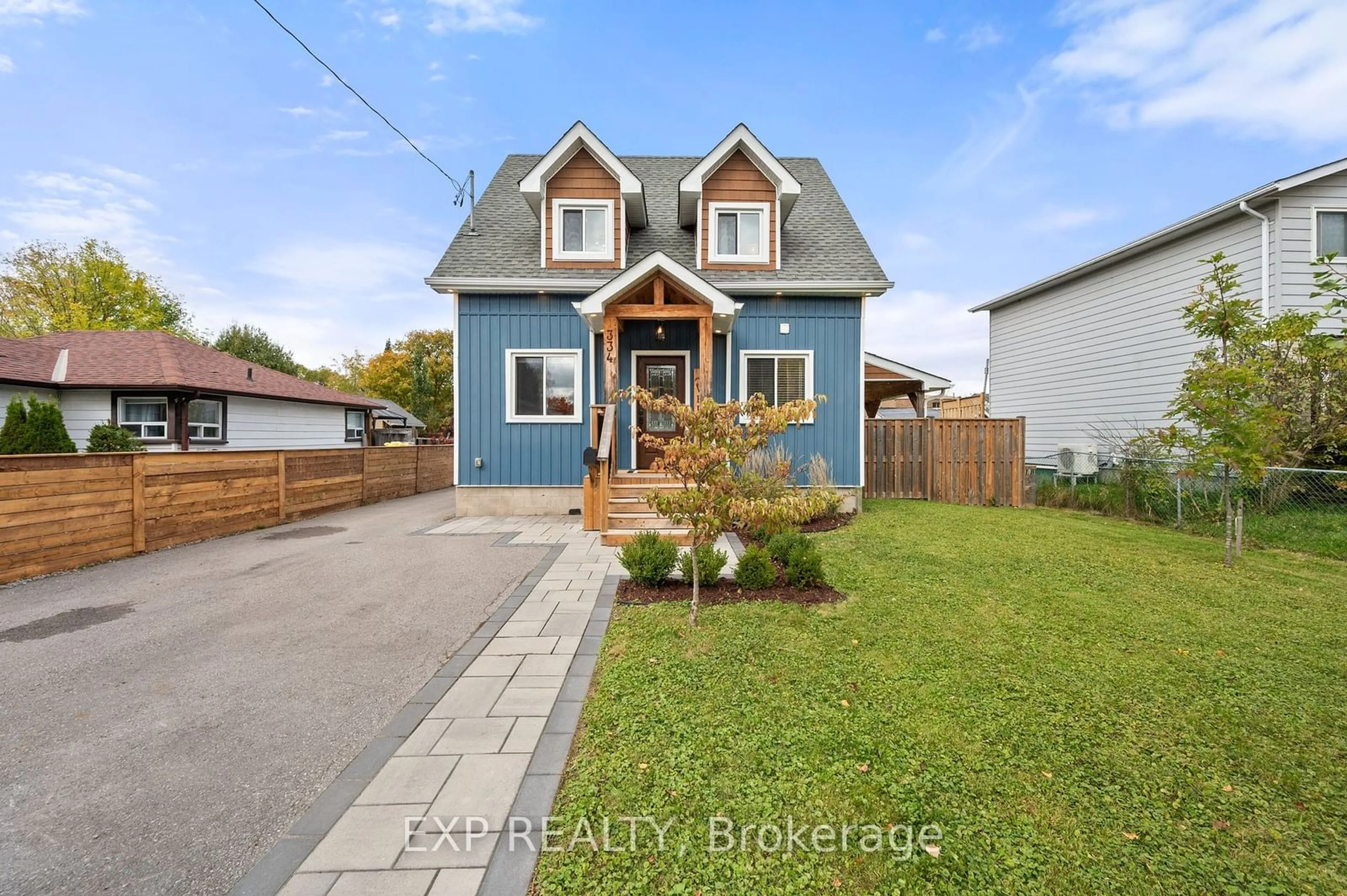 Frontside or backside of a home, the fenced backyard for 334 Hollywood Dr, Georgina Ontario L4P 3A1