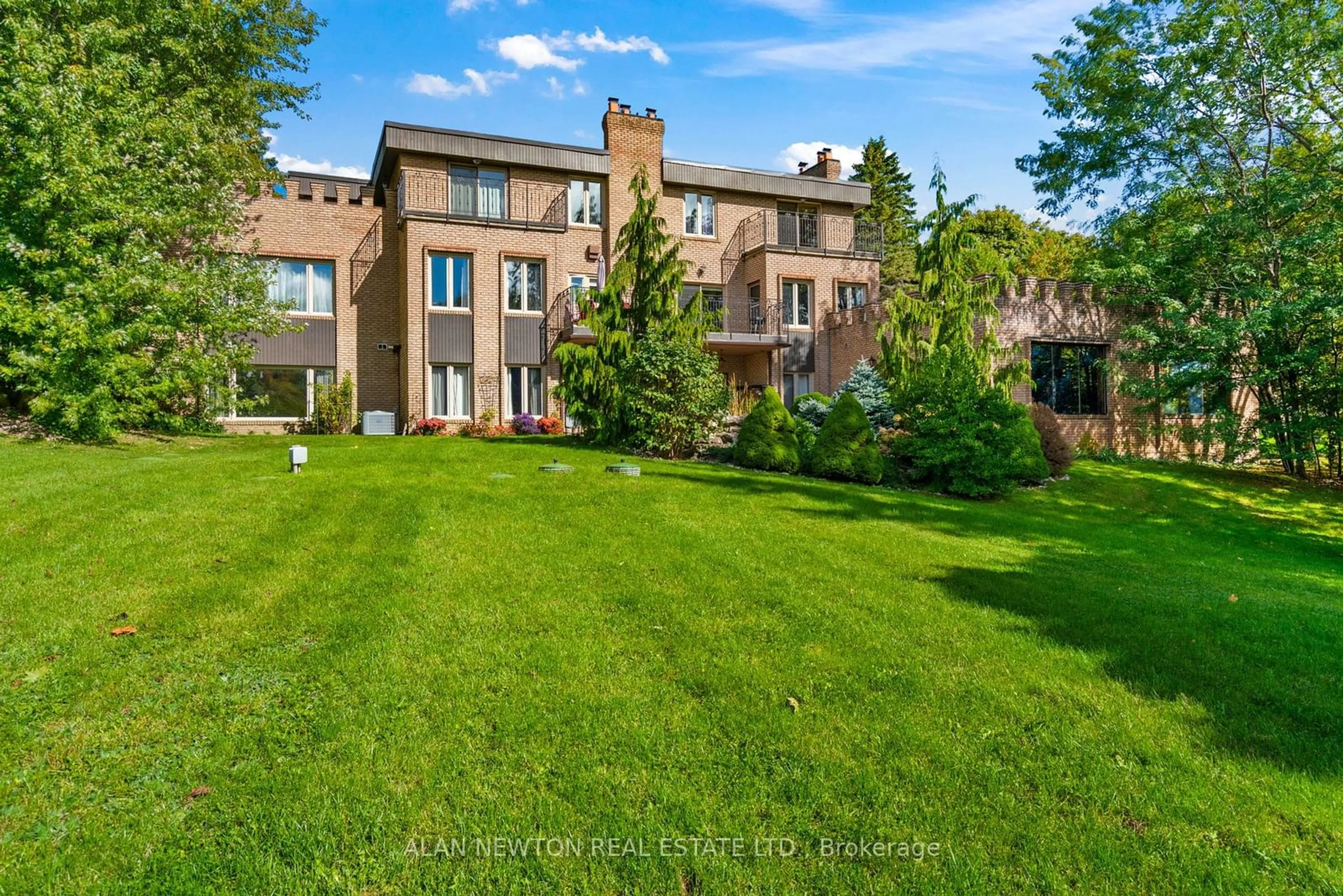 A pic from exterior of the house or condo, the fenced backyard for 12 Blueberry Lane, King Ontario L7B 1C5