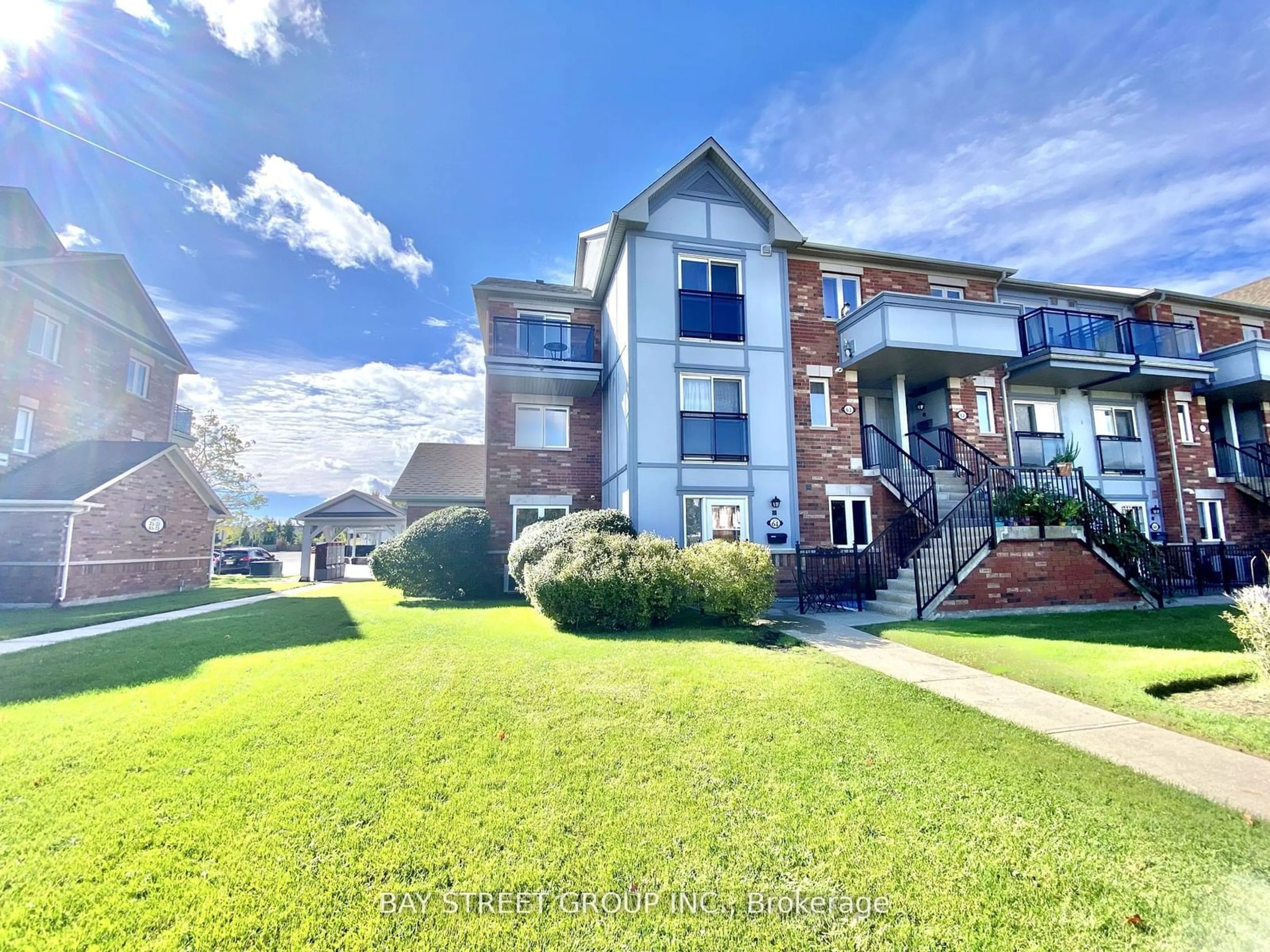 A pic from exterior of the house or condo, the street view for 2275 Bur Oak Ave #64, Markham Ontario L6E 0B8