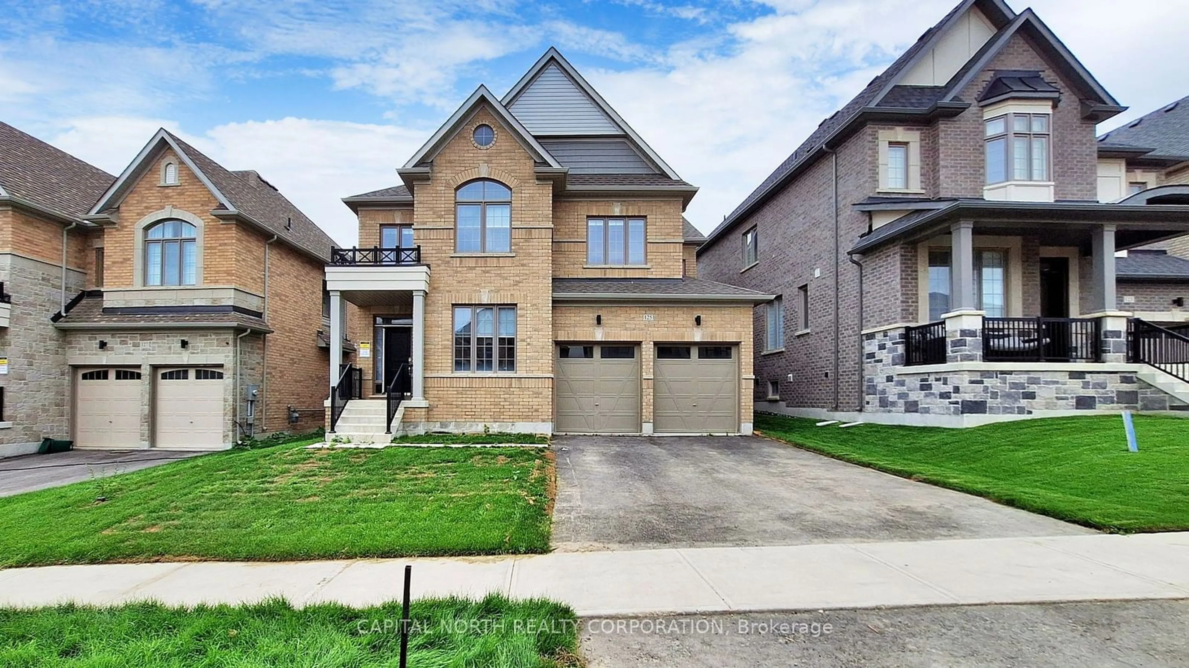 Home with brick exterior material for 125 Silk Twist Dr, East Gwillimbury Ontario L9N 0E5