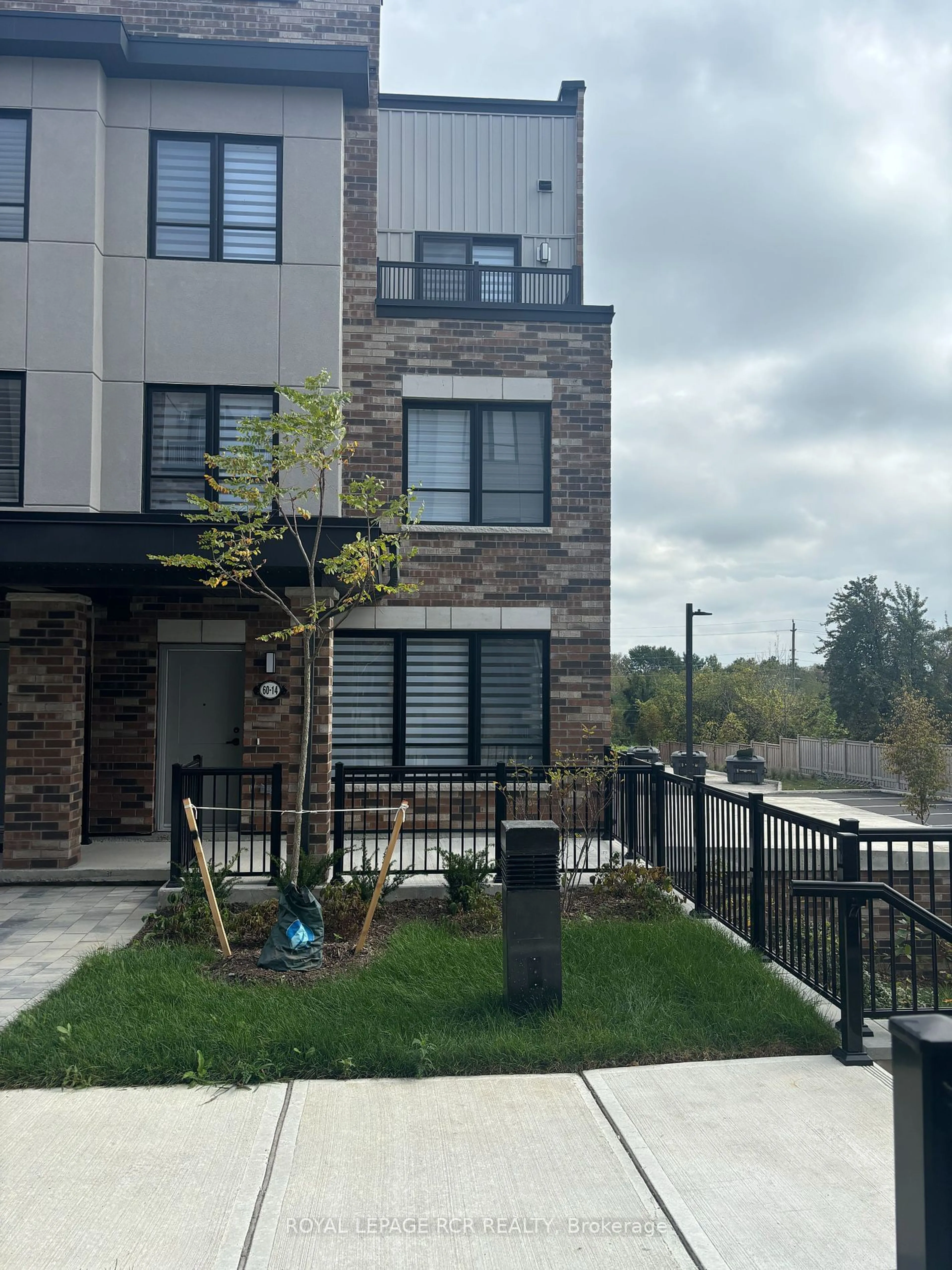 A pic from exterior of the house or condo, the fenced backyard for 60 Baynes Way #14, Bradford West Gwillimbury Ontario L3Z 4M3