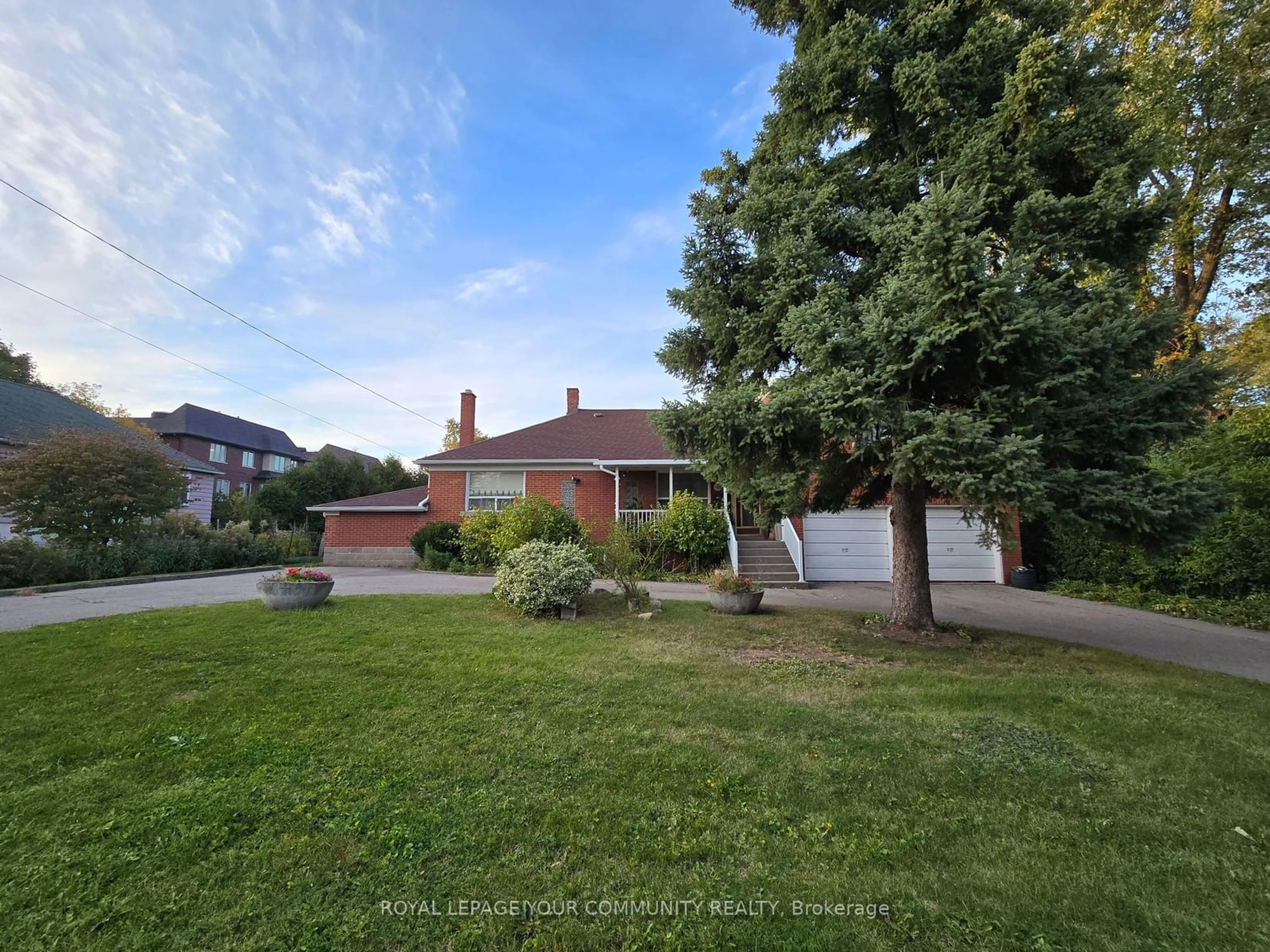 Frontside or backside of a home, the fenced backyard for 100 Langstaff Rd, Richmond Hill Ontario L4C 6N3