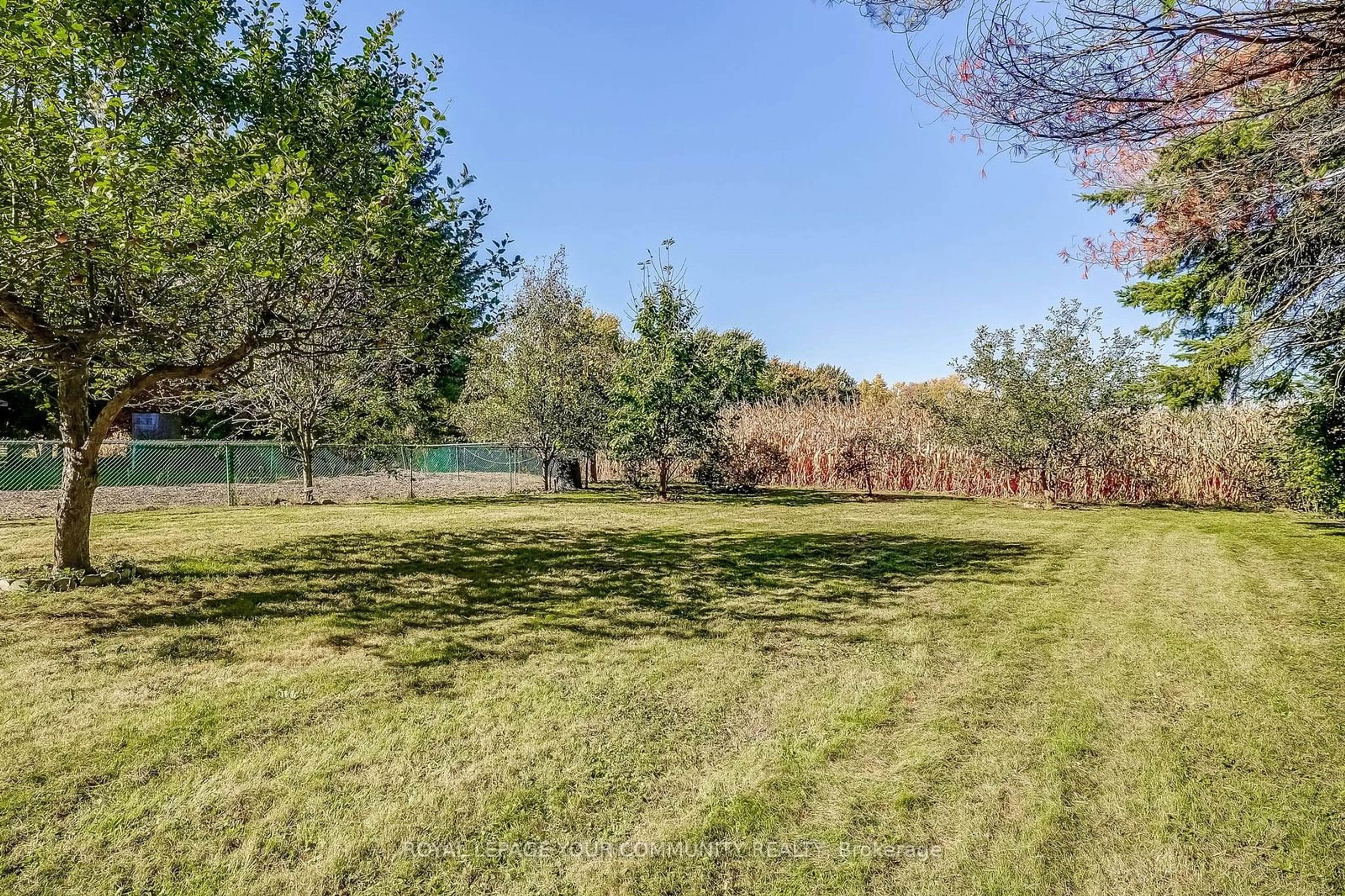 A pic from exterior of the house or condo, the fenced backyard for 2408 14th Line, Innisfil Ontario L0L 1R0