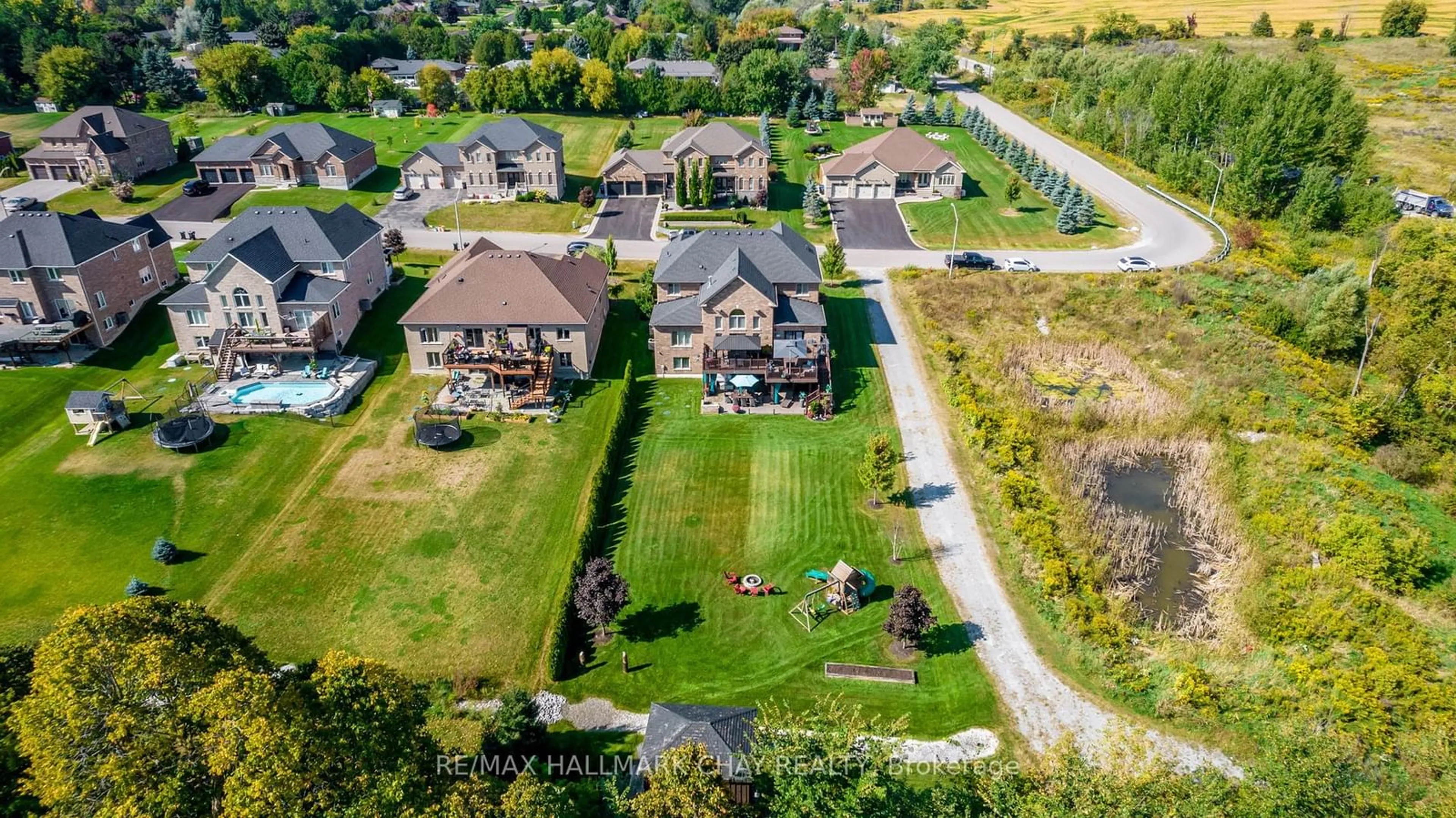 Frontside or backside of a home, the fenced backyard for 3 Keenan Dr, Adjala-Tosorontio Ontario L0G 1L0