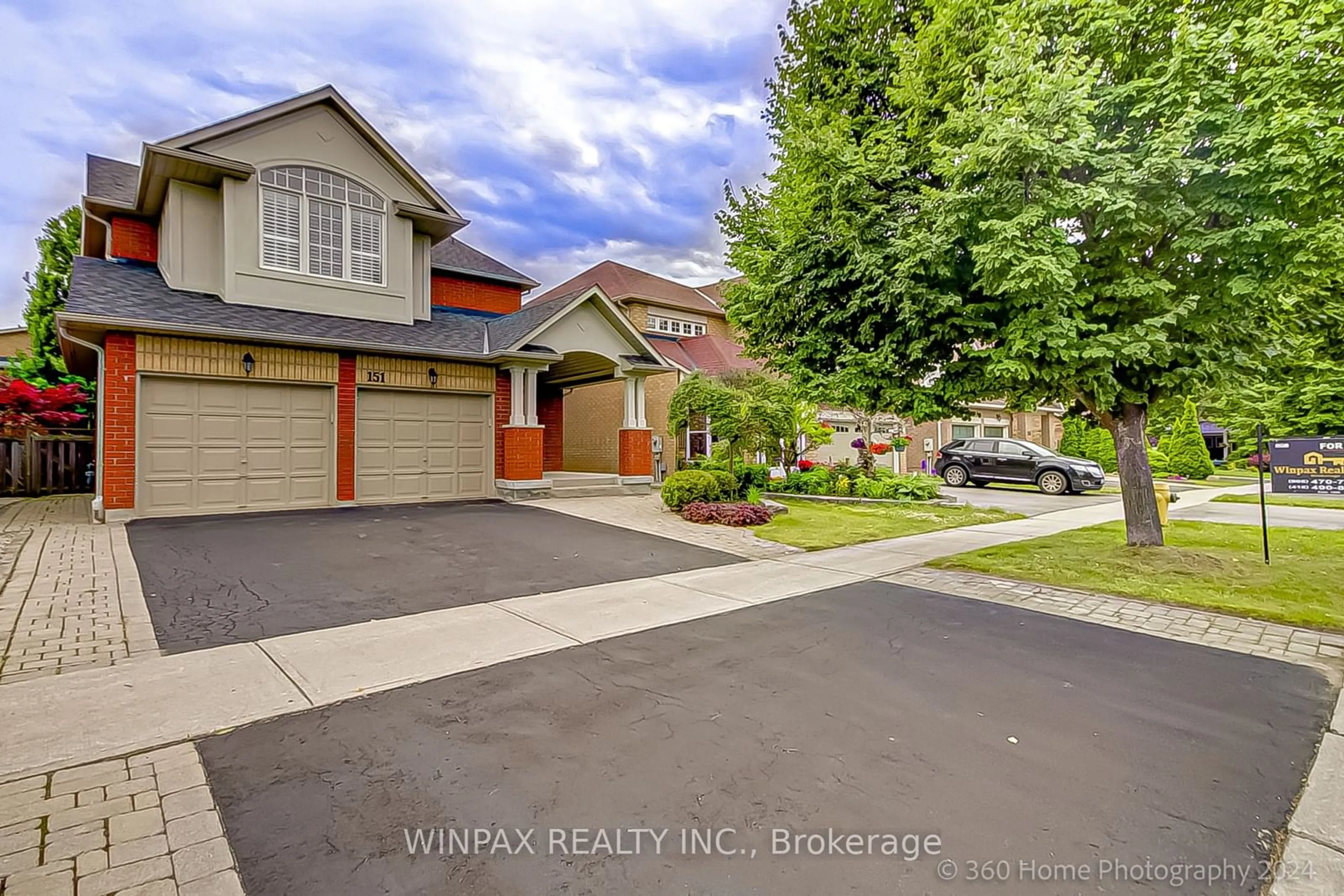 Frontside or backside of a home, the street view for 151 Russell Jarvis Dr, Markham Ontario L3S 4L2