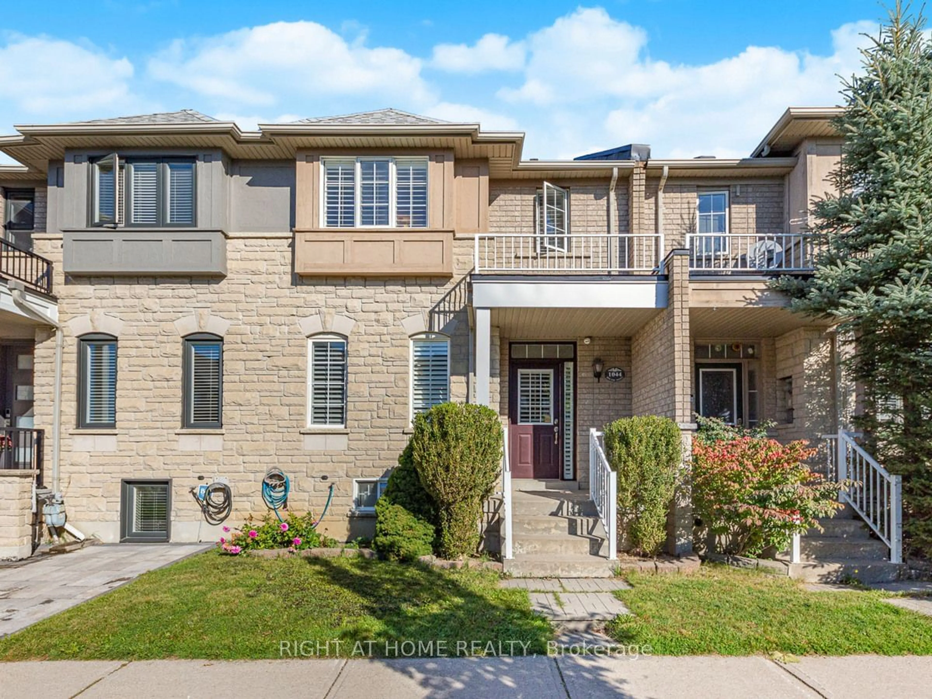 A pic from exterior of the house or condo, the street view for 1044 Bur Oak Ave, Markham Ontario L6E 1H7