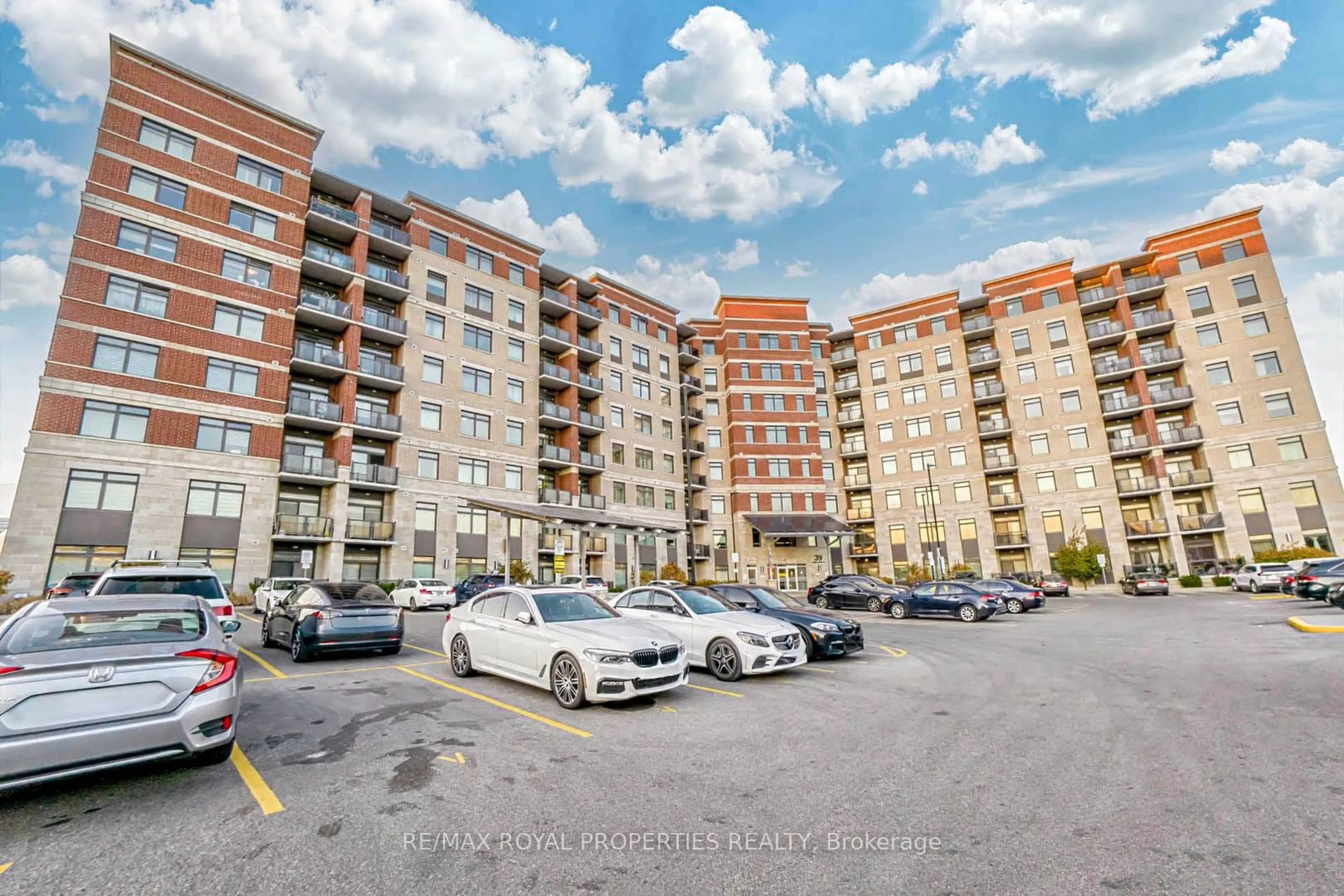 A pic from exterior of the house or condo, the street view for 39 New Delhi Dr #407, Markham Ontario L3S 0E1