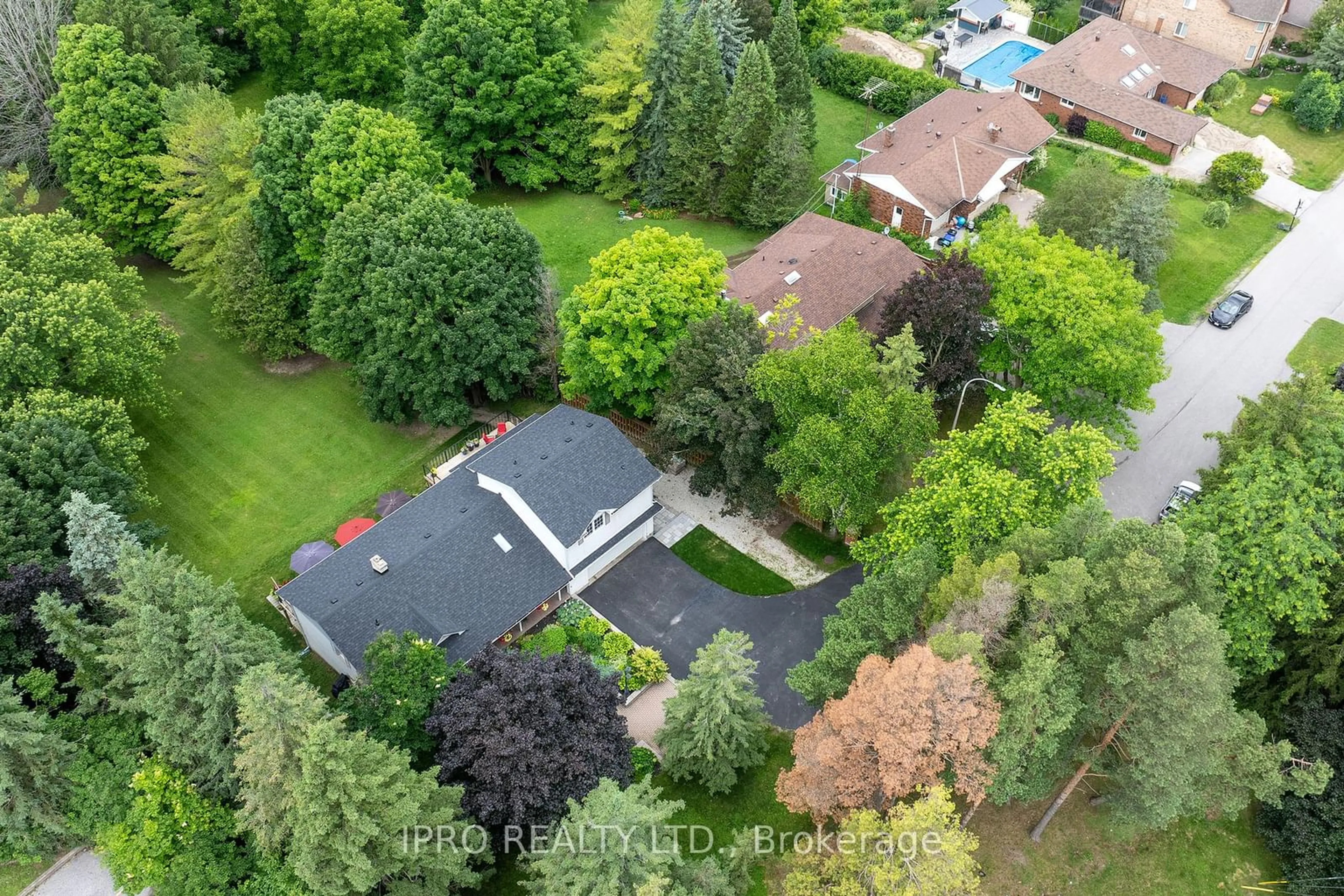 Frontside or backside of a home, the fenced backyard for 44 Rodcliff Rd, New Tecumseth Ontario L0G 1W0