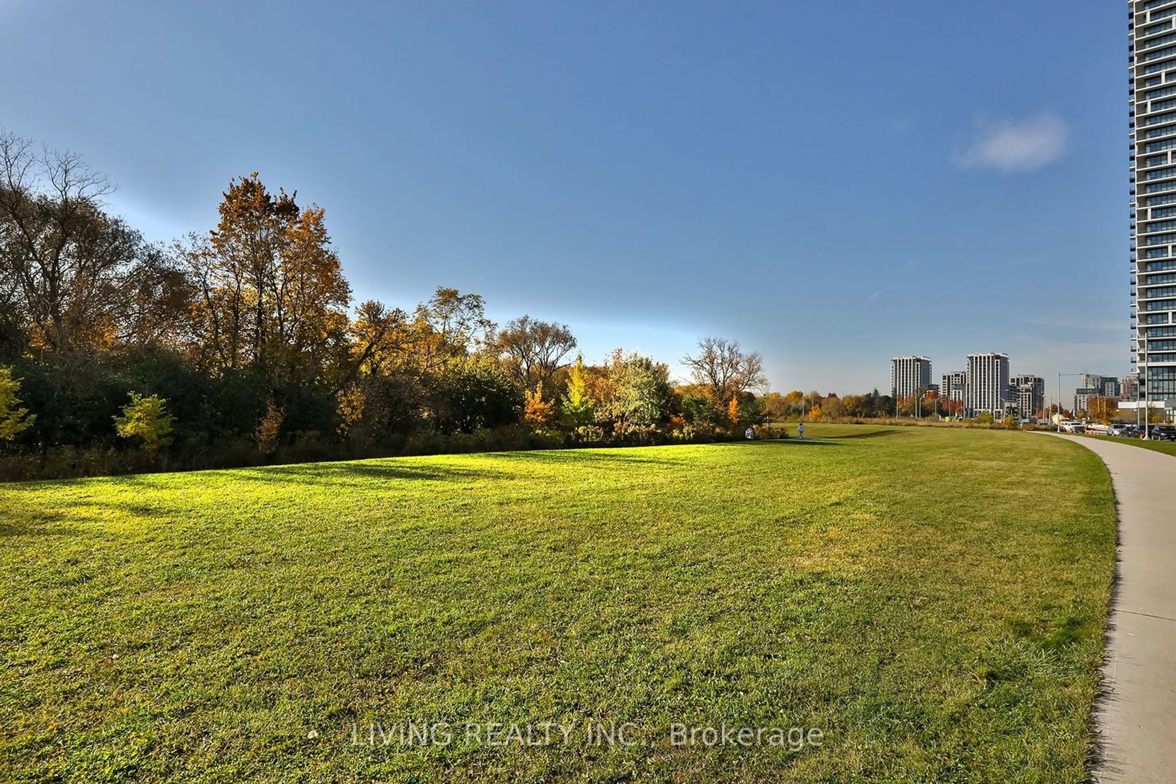 A pic from exterior of the house or condo, the fenced backyard for 15 Water Walk Dr #2806, Markham Ontario L6G 0G2