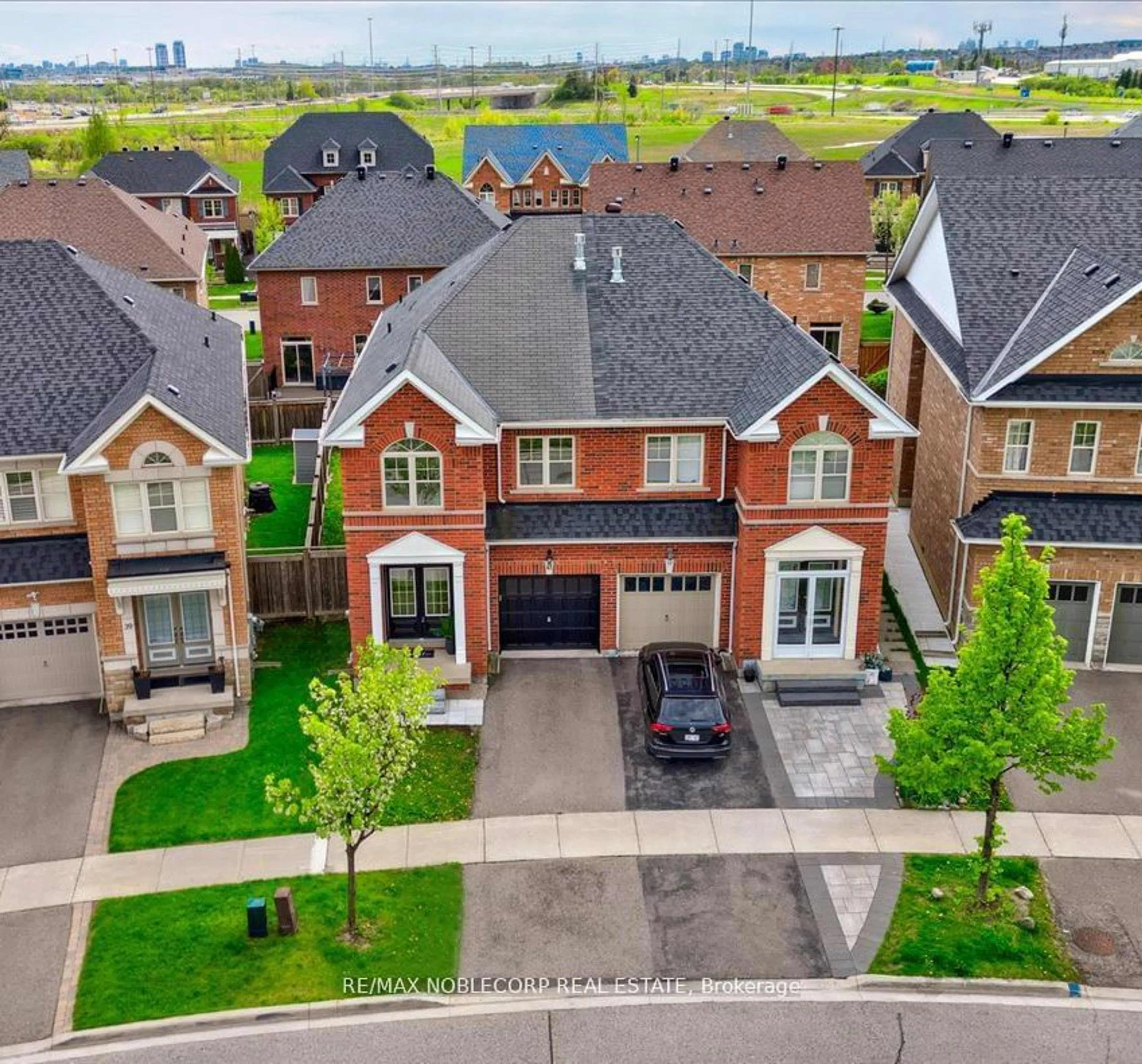 A pic from exterior of the house or condo, the street view for 41 Robert Osprey Dr, Markham Ontario L6C 0L1