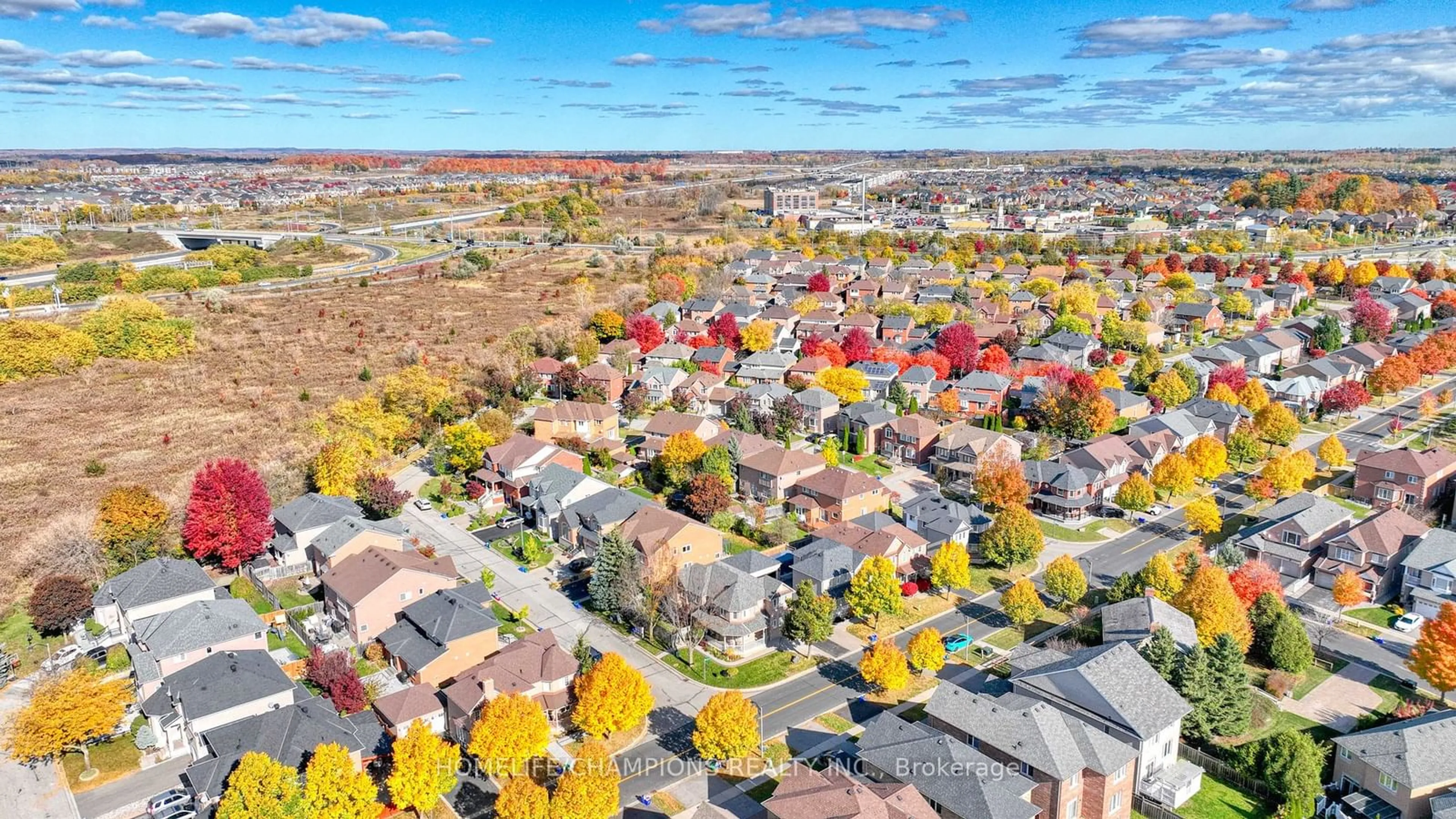 A pic from exterior of the house or condo, the street view for 100 Russell Jarvis Dr, Markham Ontario L3S 4B3