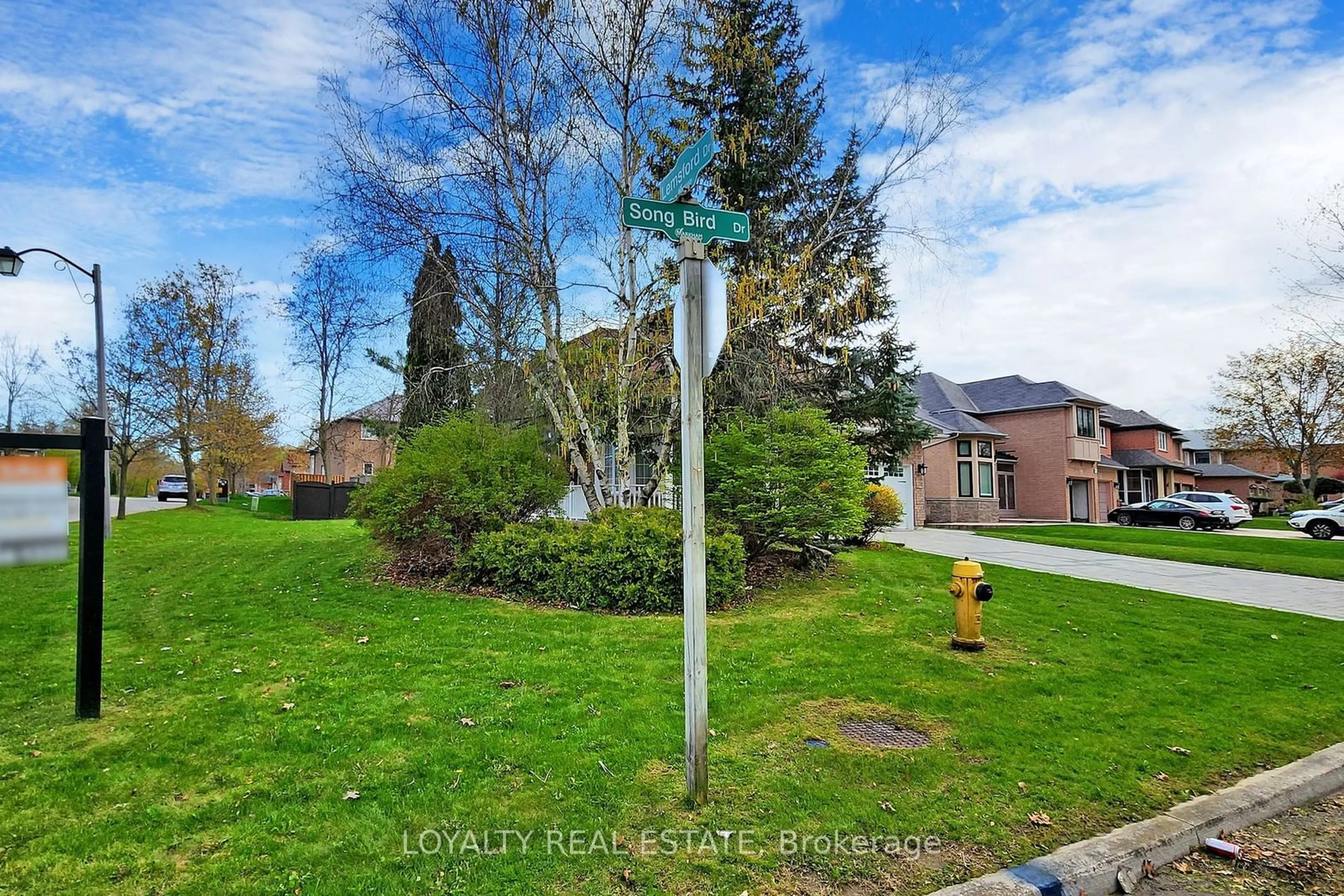 A pic from exterior of the house or condo, the street view for 97 Song Bird Dr, Markham Ontario L3S 3T8