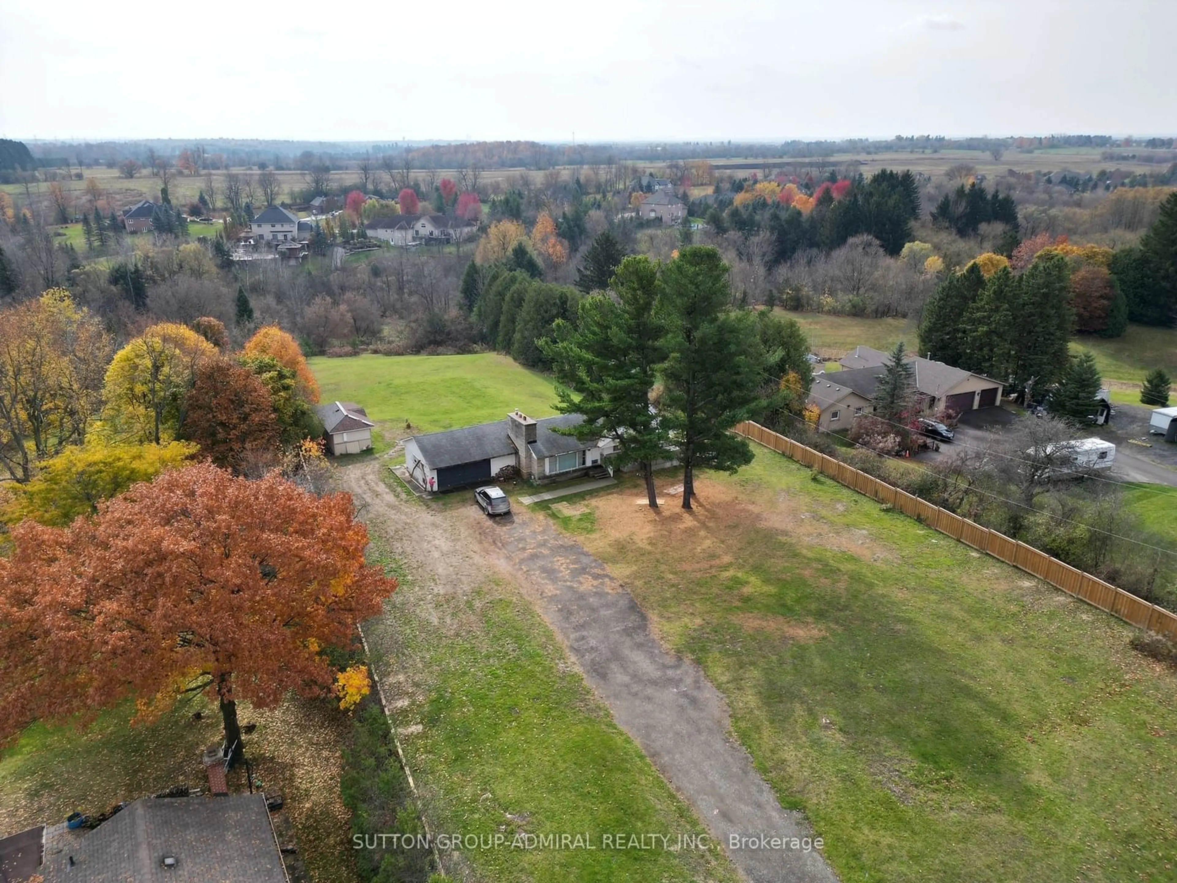 Frontside or backside of a home, the fenced backyard for 5495 King Rd, King Ontario L0G 1N0