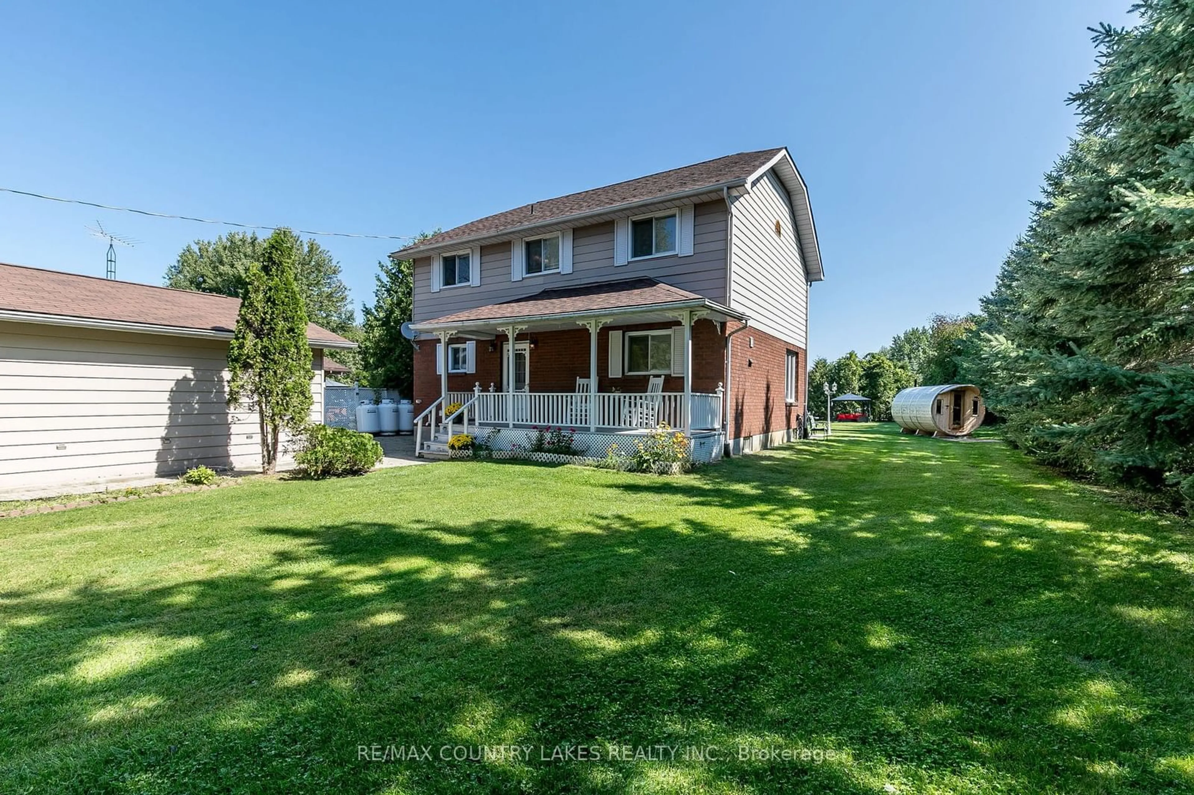 Frontside or backside of a home, the fenced backyard for 47 Lake Ave, Ramara Ontario L0K 1B0